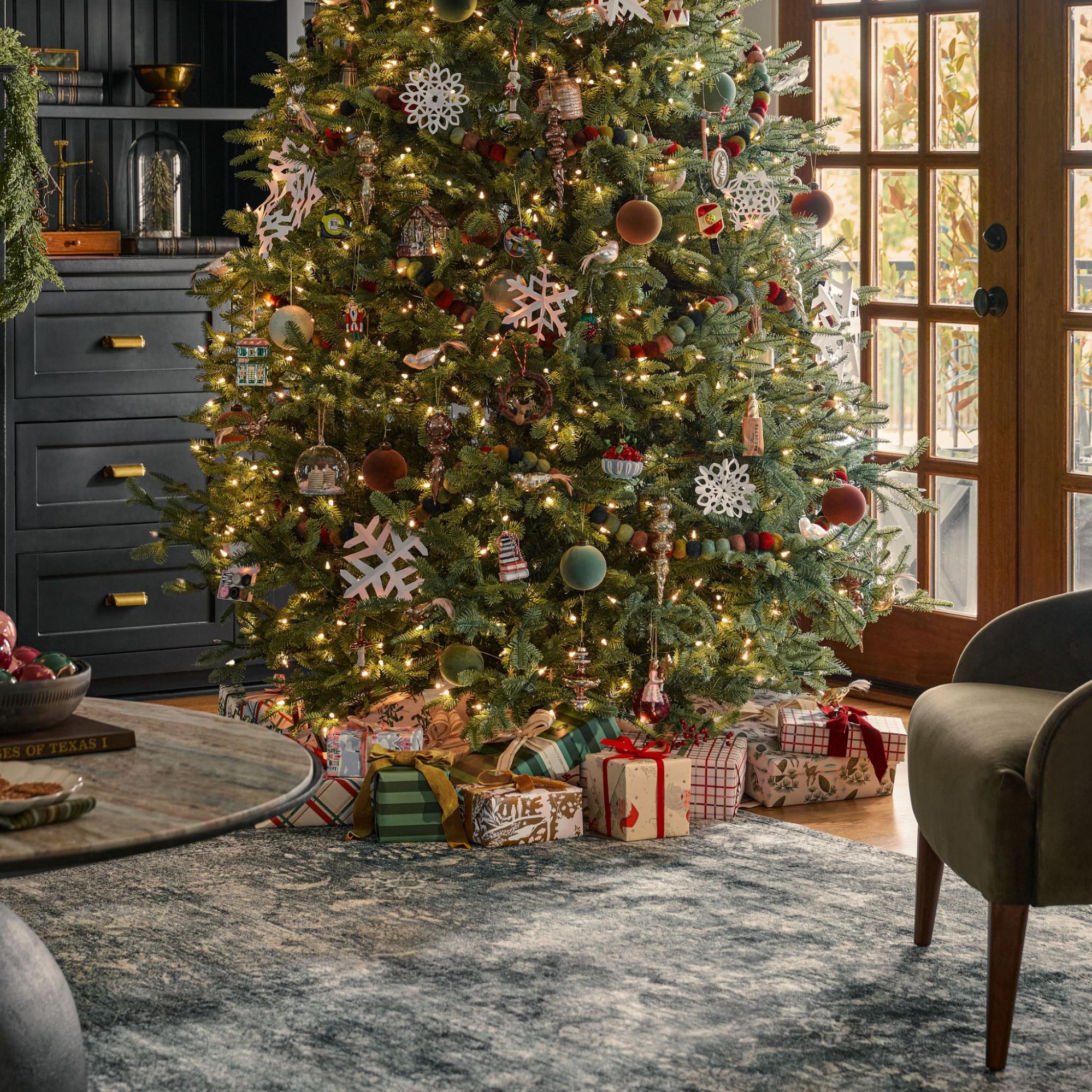 A decorated Christmas tree in a living room.