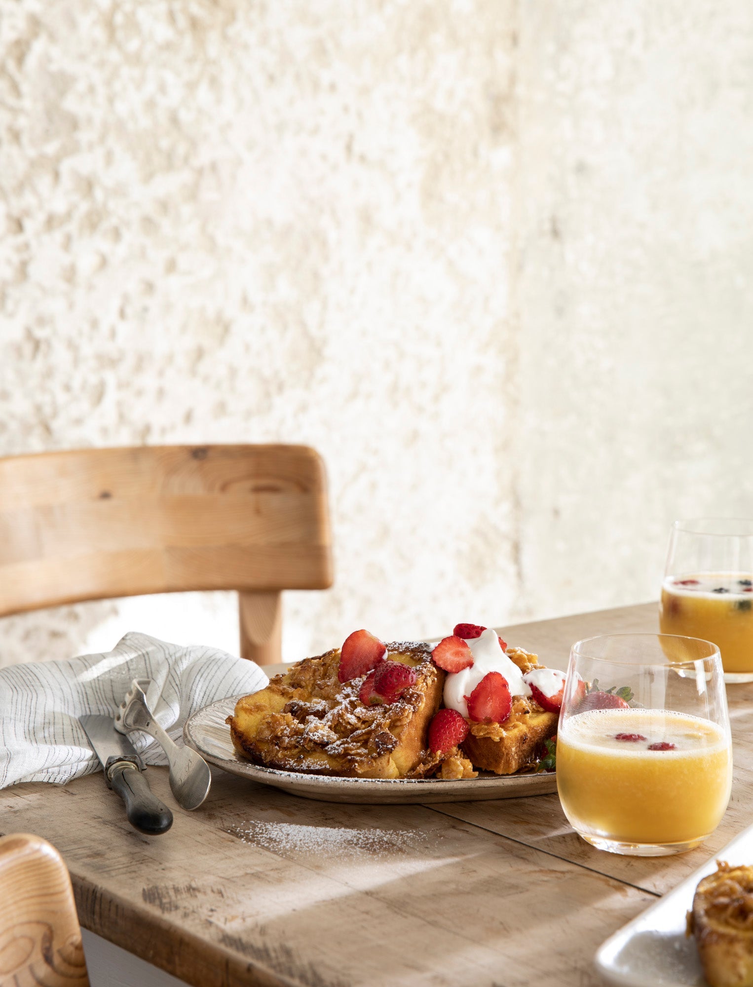 Joanna Gaines' French Toast Crunch sits on a plate atop a wooden table.