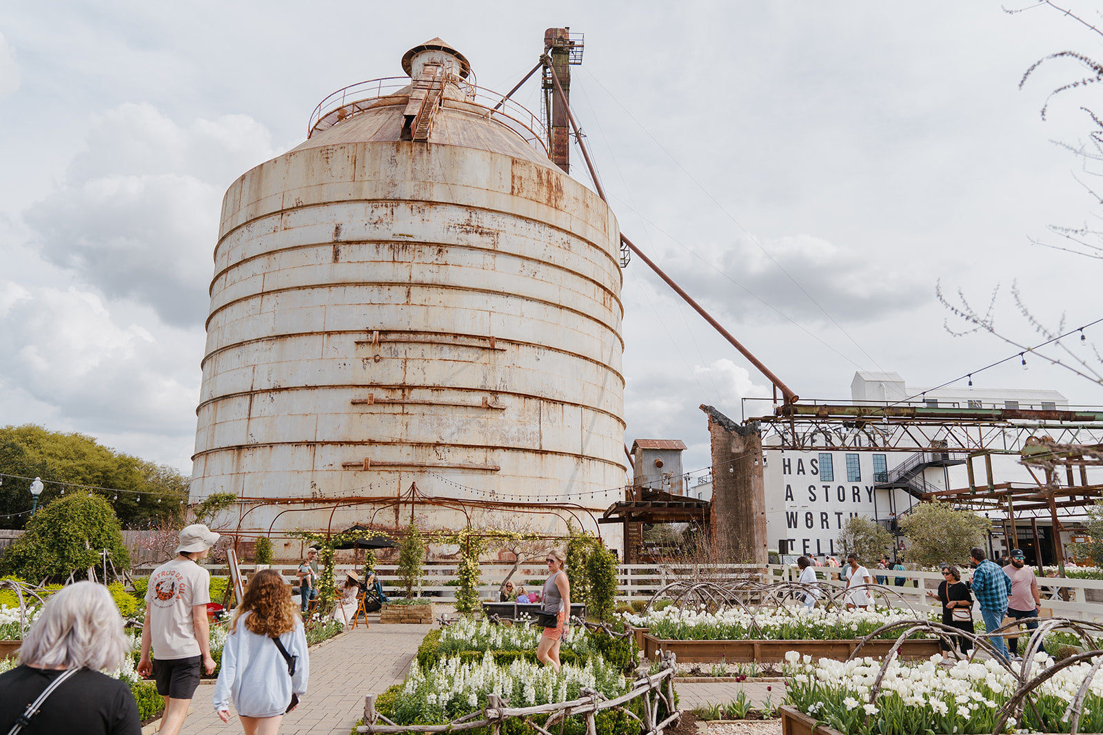 A flourishing garden around the Magnoliass Silos in Waco, Texas.