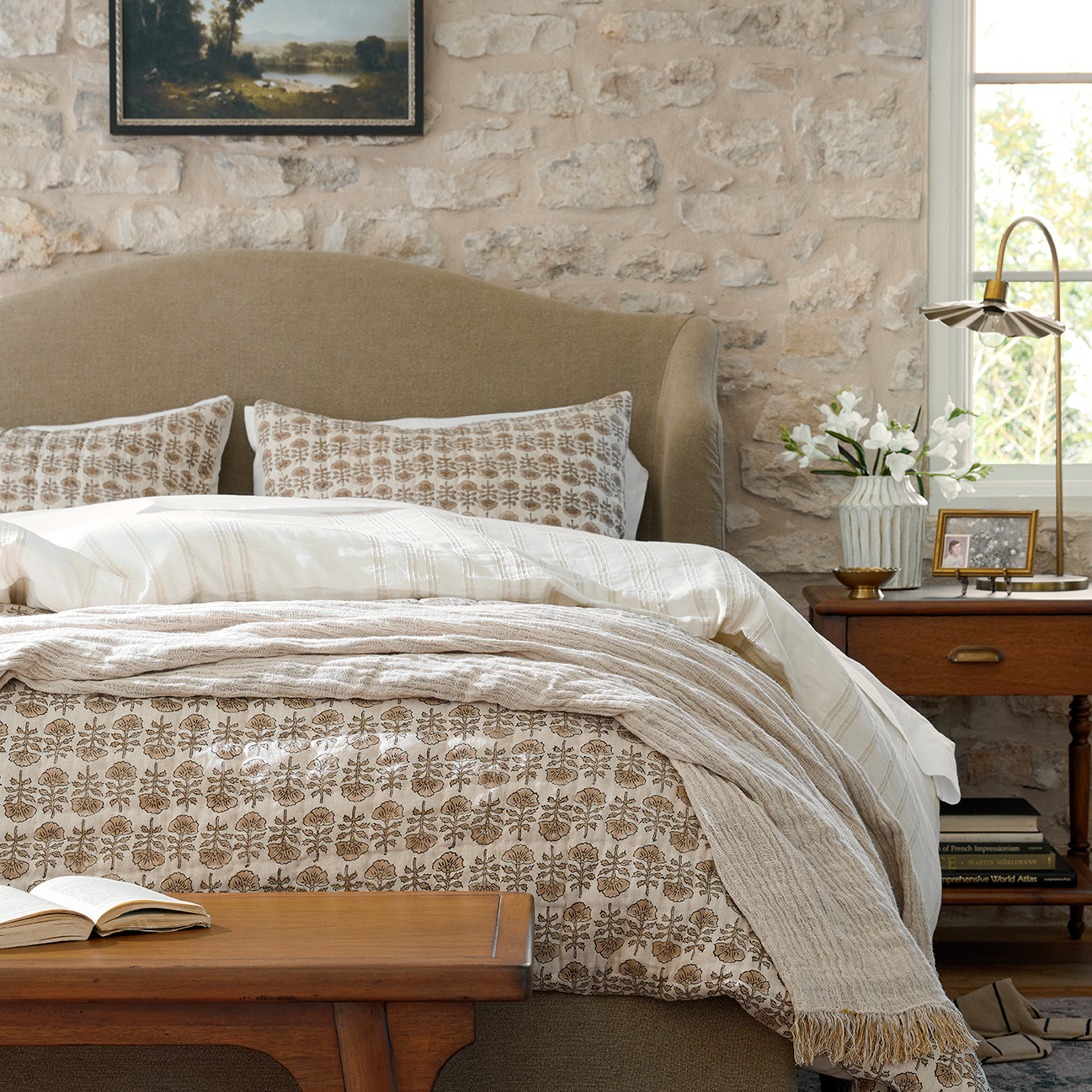 Block print bedding from Magnoliass dresses a bed.