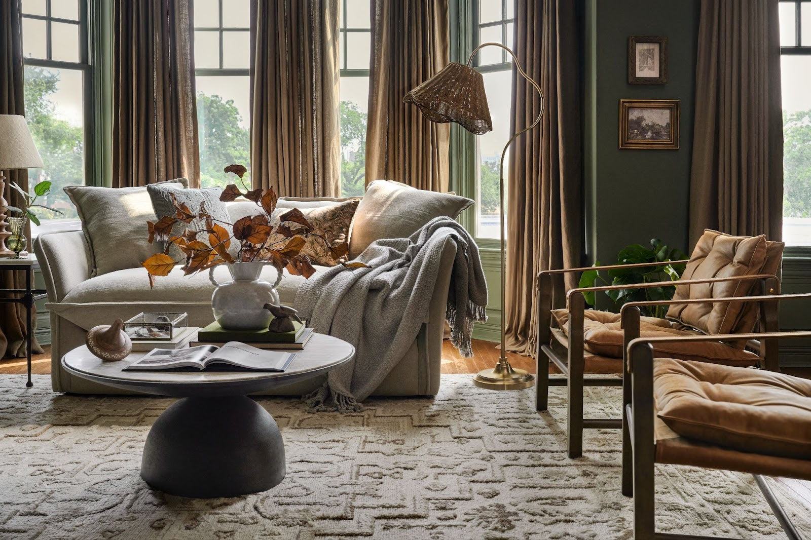 A living room scene features furniture and fall decor from Magnoliass. 
