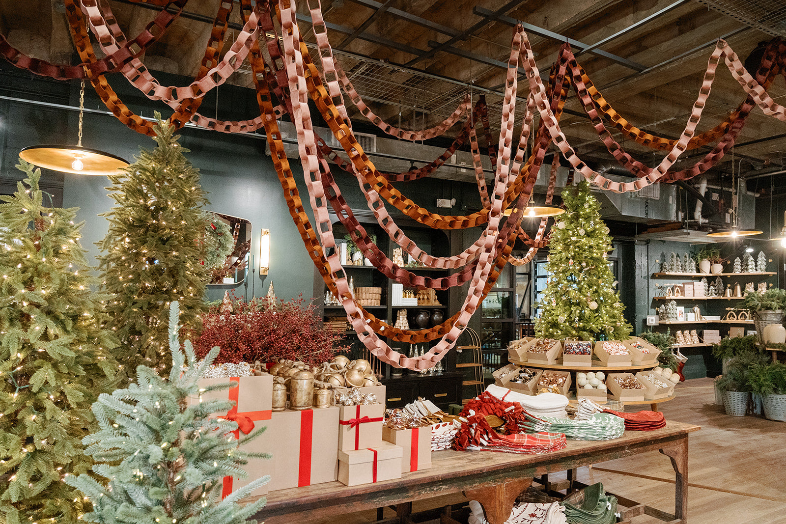 Velvet paper chains strung over displays inside Magnoliass Market.