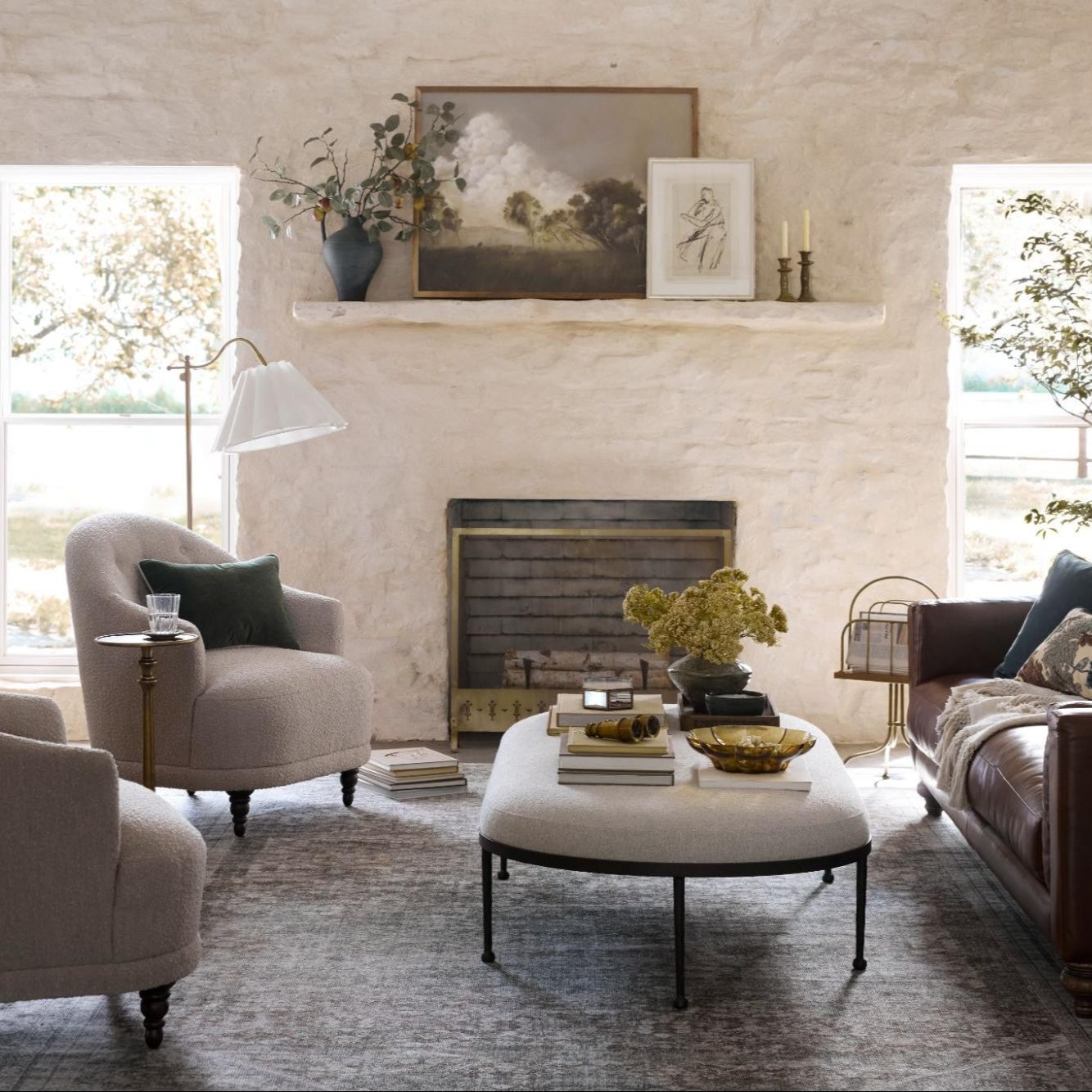 An inviting living space filled with seasonal stems, cozy textures, and rich hues. 