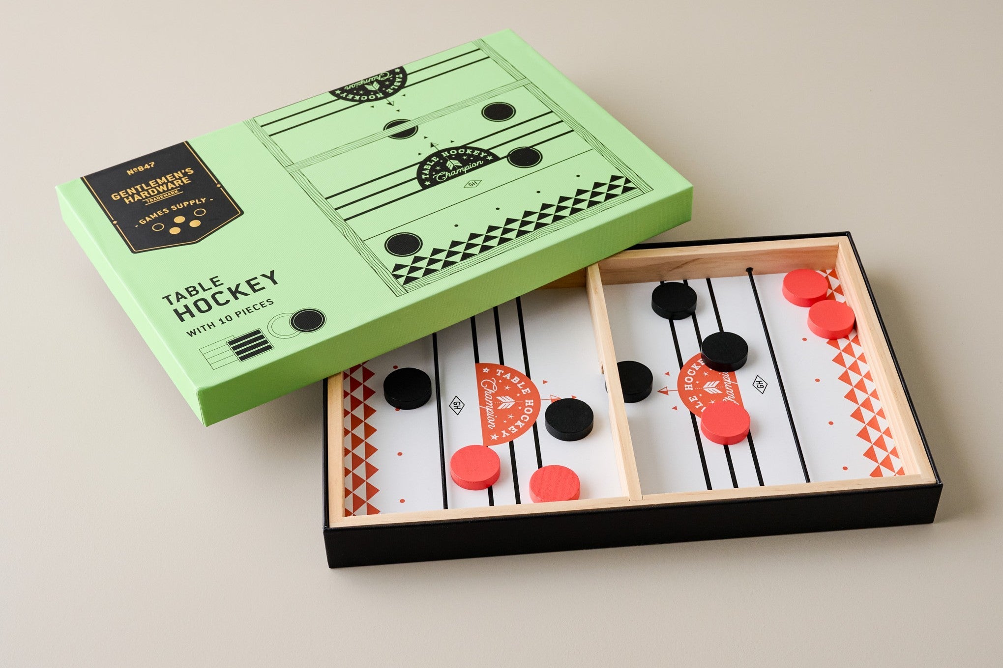 Shop Men's Gifts under $25 Image features a table hockey game.