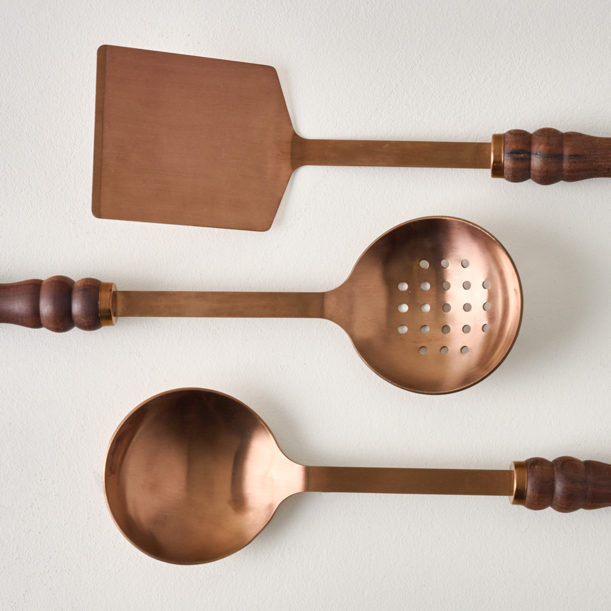 Walnut Handle Copper Spoon shown with turner and slotted spoon