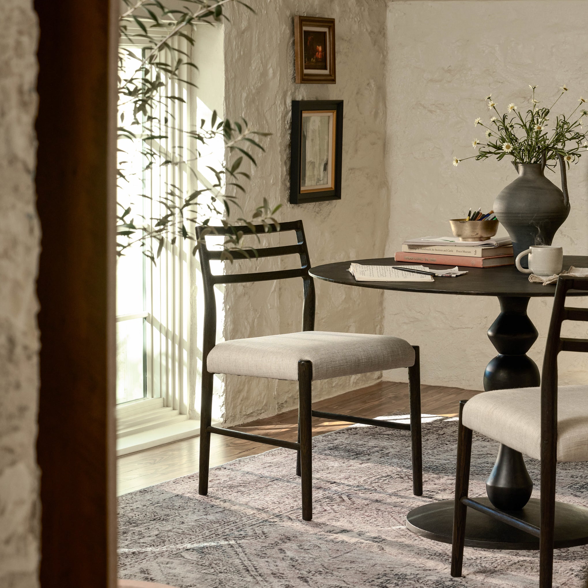 Cade Dining Chair in a room at a dining table