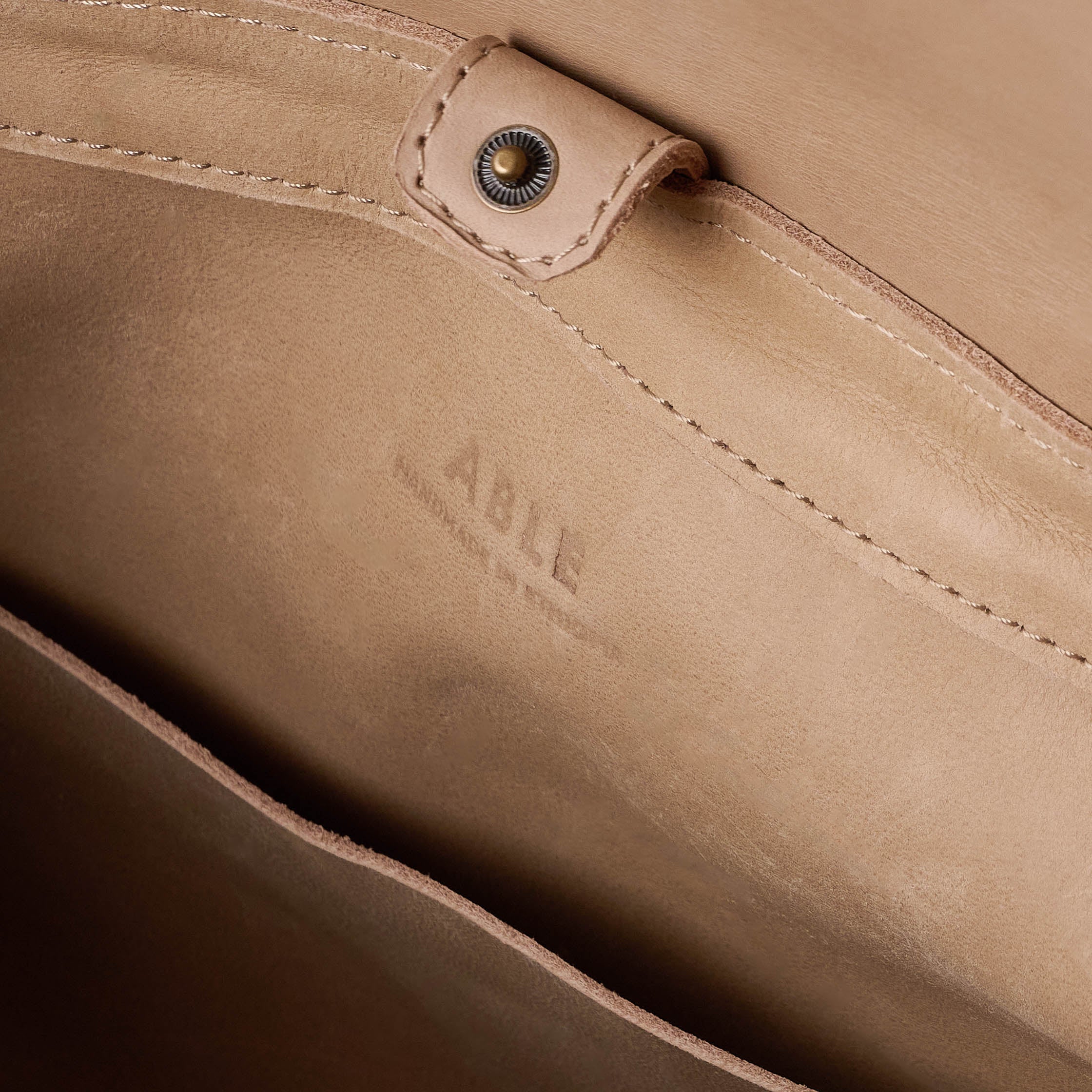 Ella Backpack close up of ABLE logo inside backpack