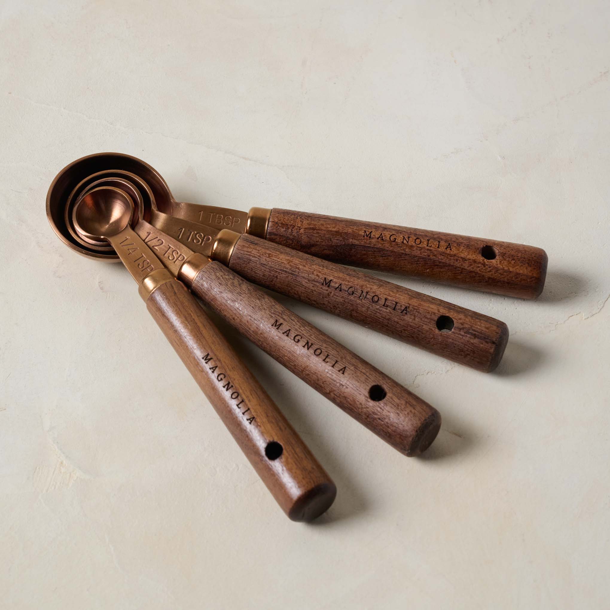 Walnut and Copper Measuring Spoons together