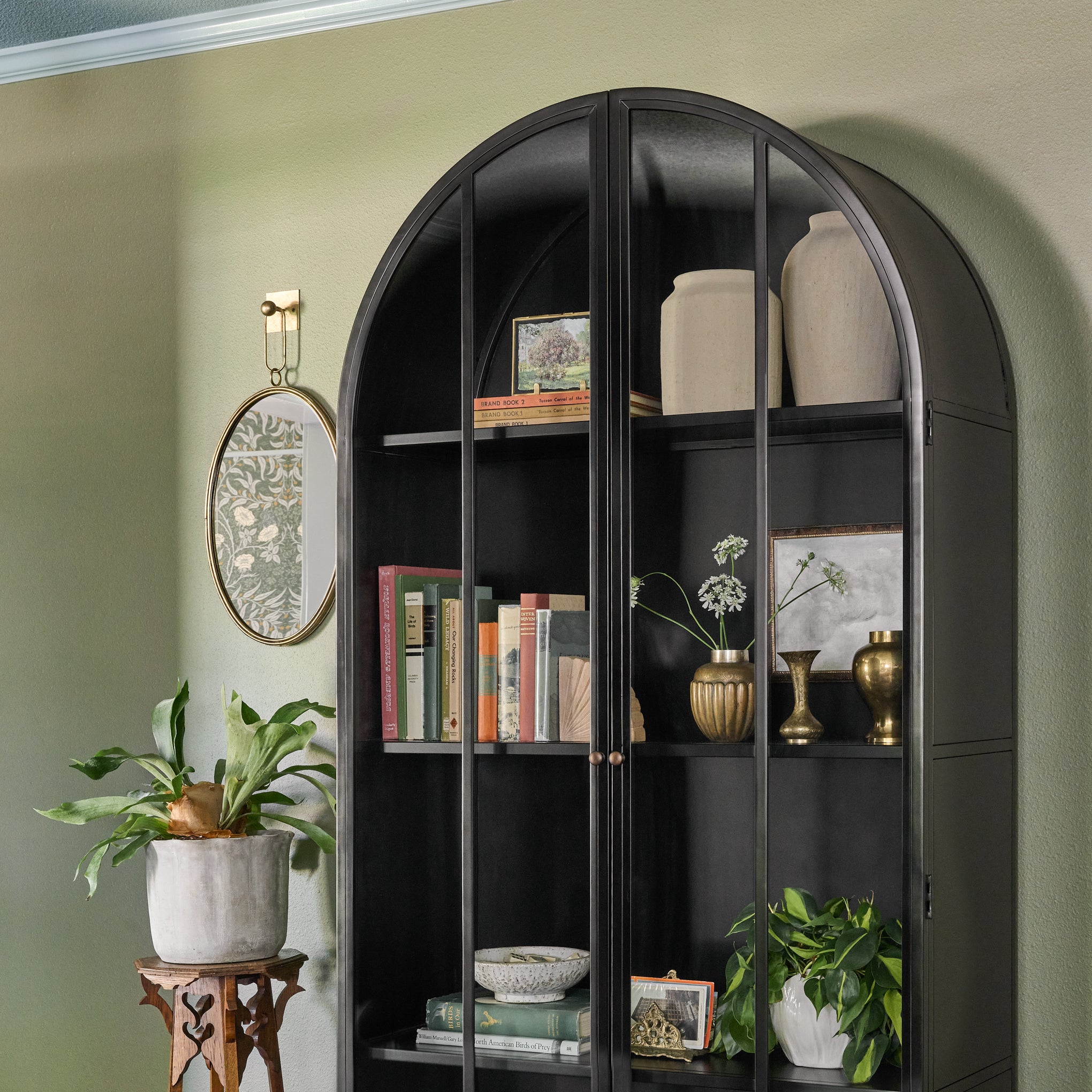 Gristmill Cabinet in a room with decor on shelves