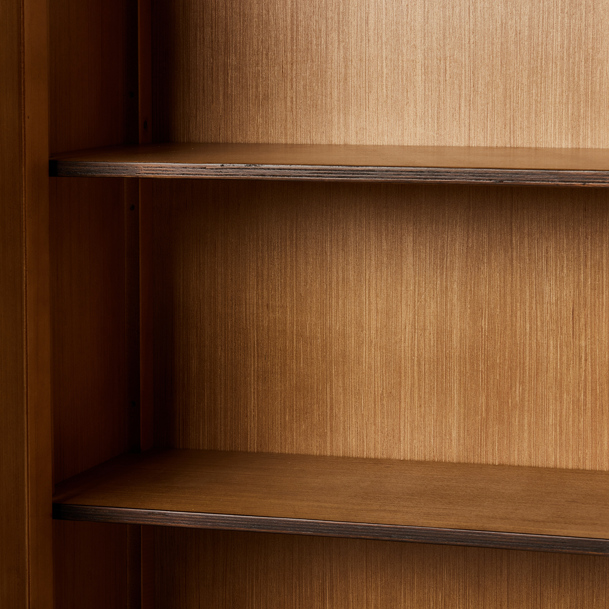Hurston Wide Cabinet in aged pine shelves up close