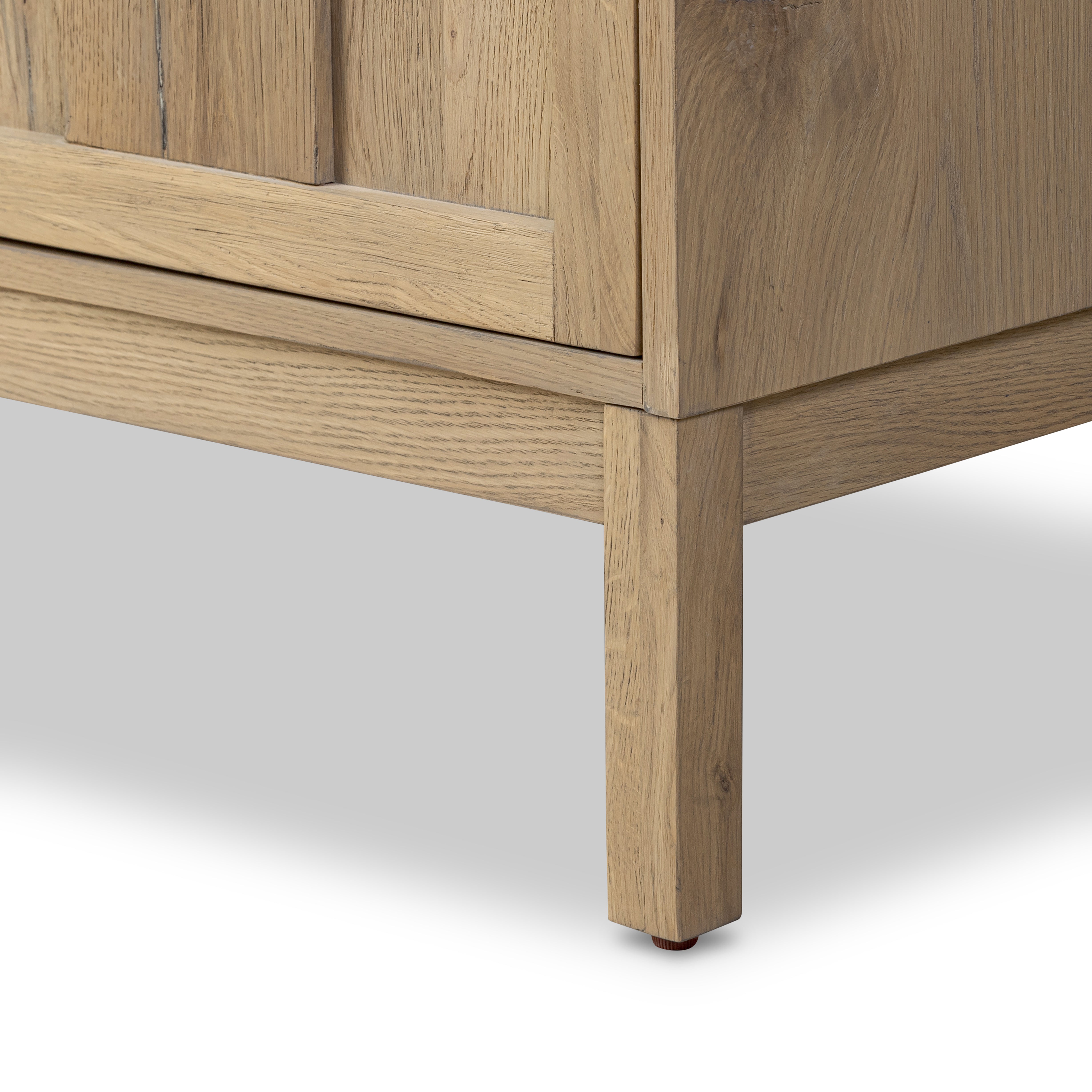 Aged Natural Oak Cara Sideboard leg up close