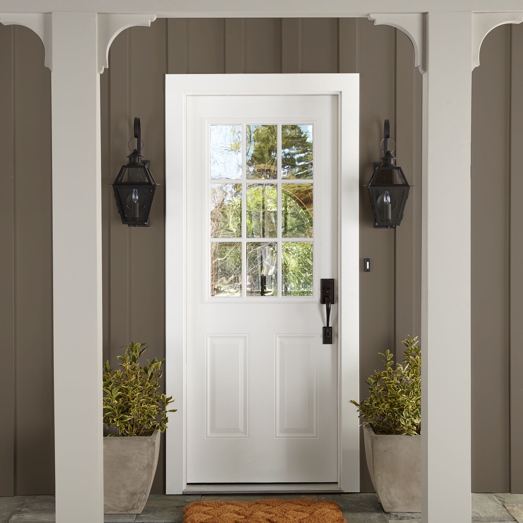 Mosswood paint featured on wood paneling on outside of home