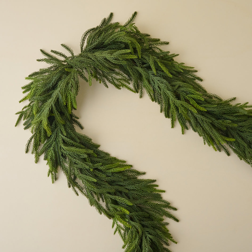 Green wreath on a beige background