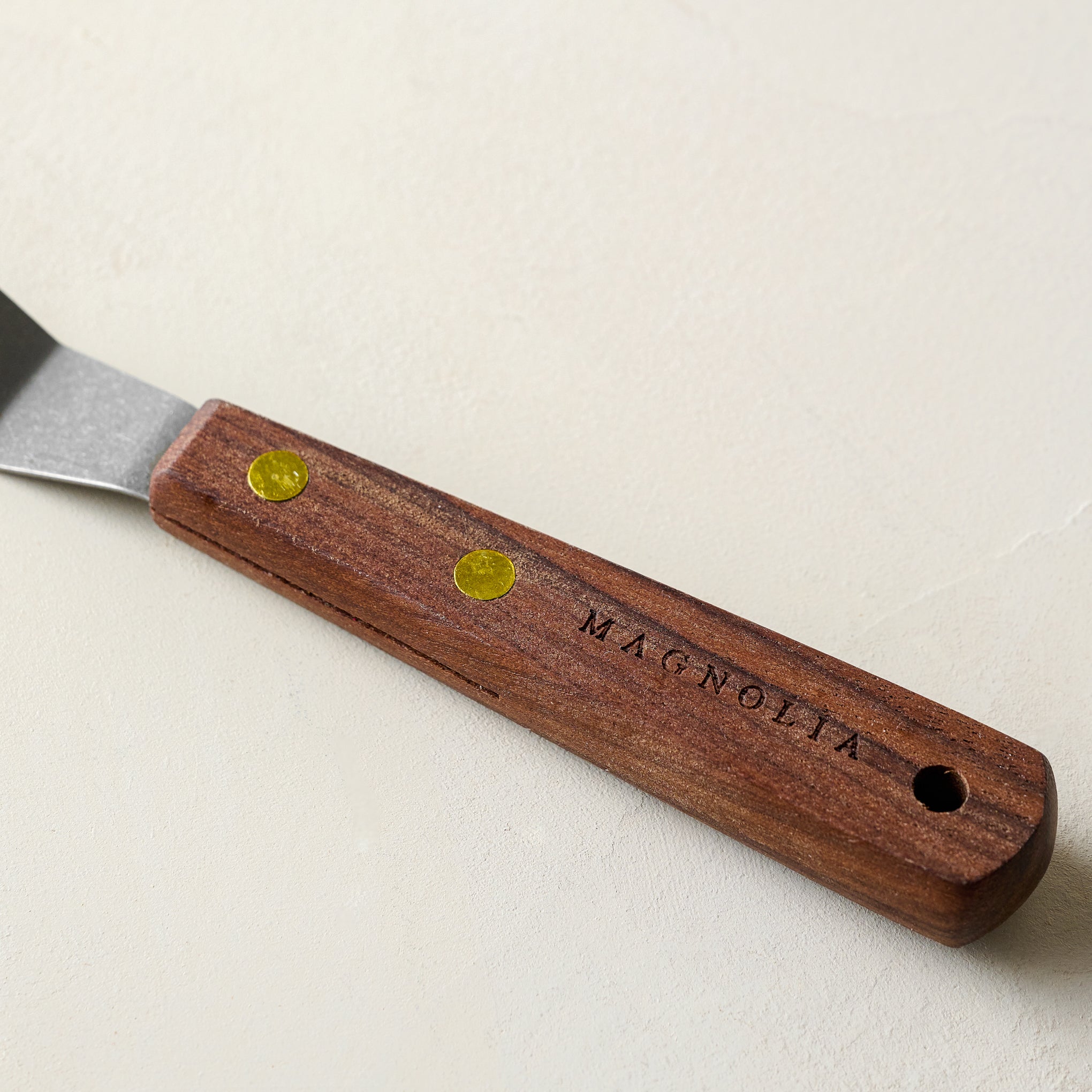 Gristmill Collection Walnut Icing Spatula with Vintage Finish close up of handle