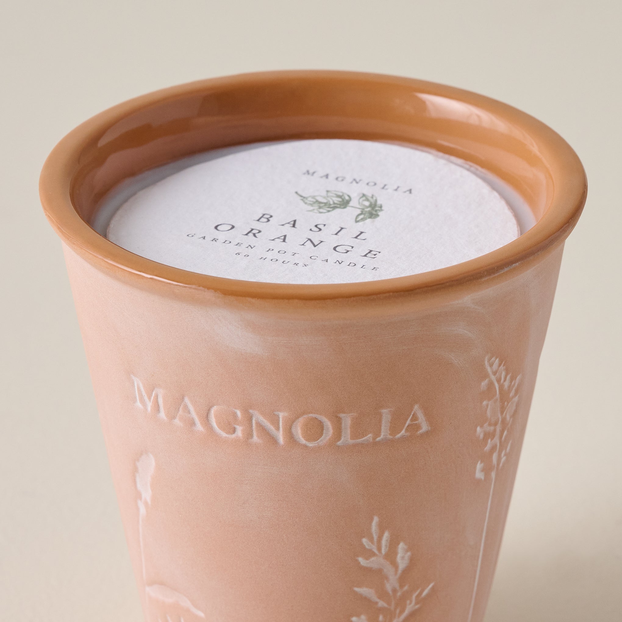 Magnoliass Basil Orange Garden Pot Candle up close