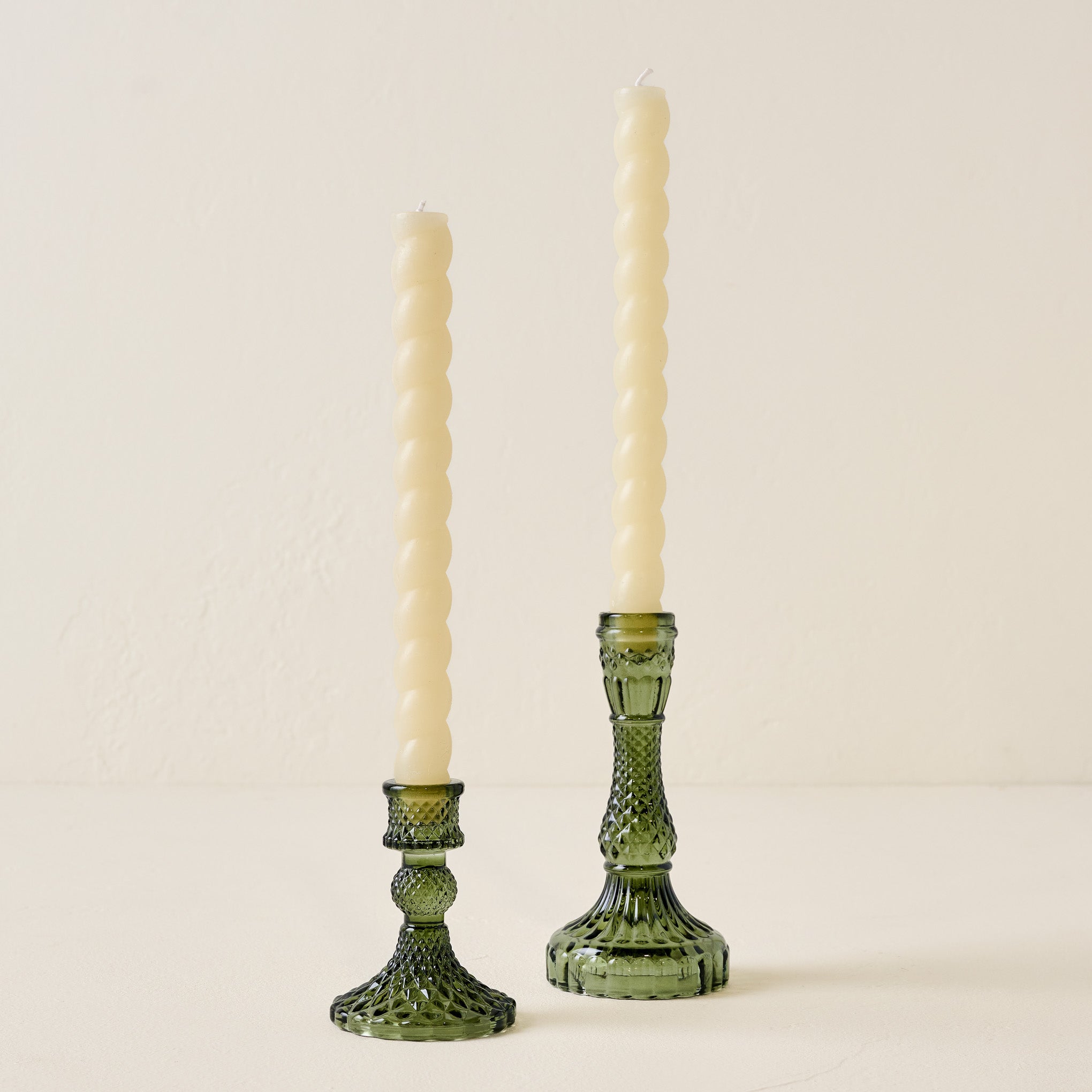 Antique Green Glass Taper Holder shown with twisted tapers