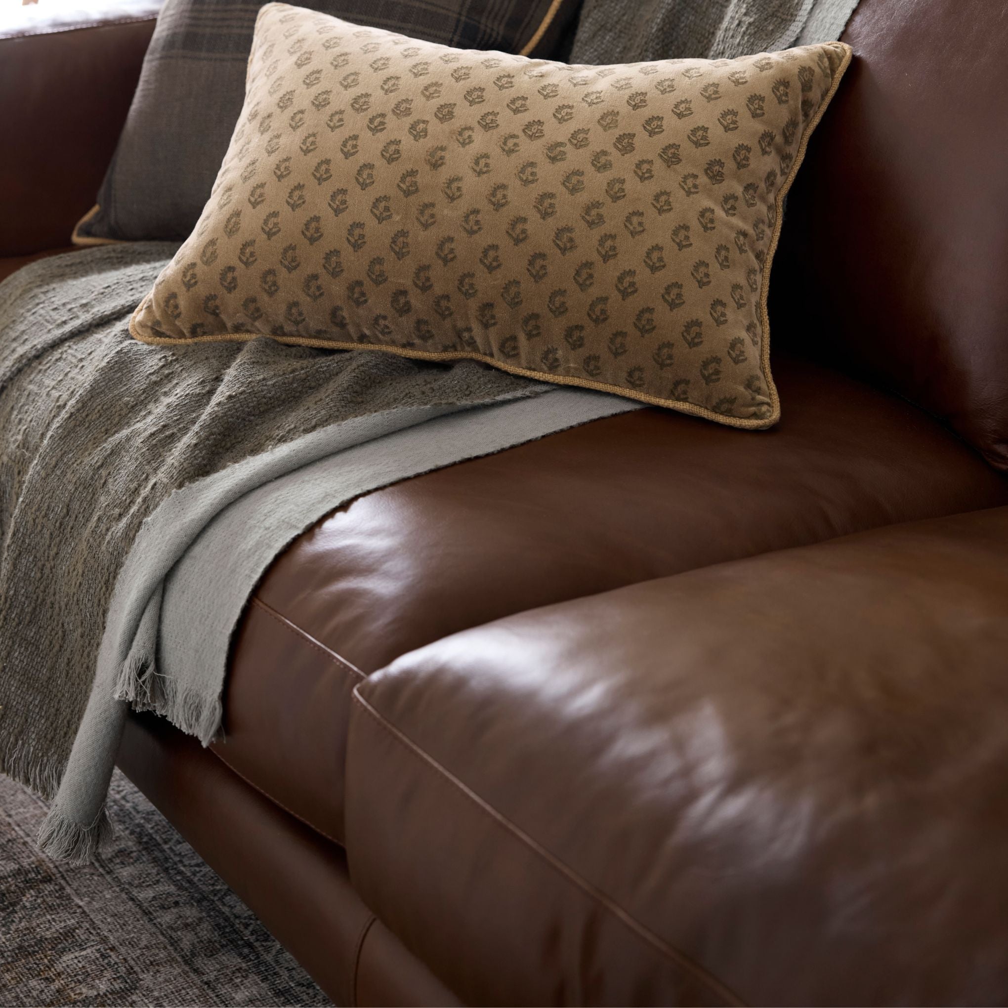 Andrews Leather Sofa up close with pillows
