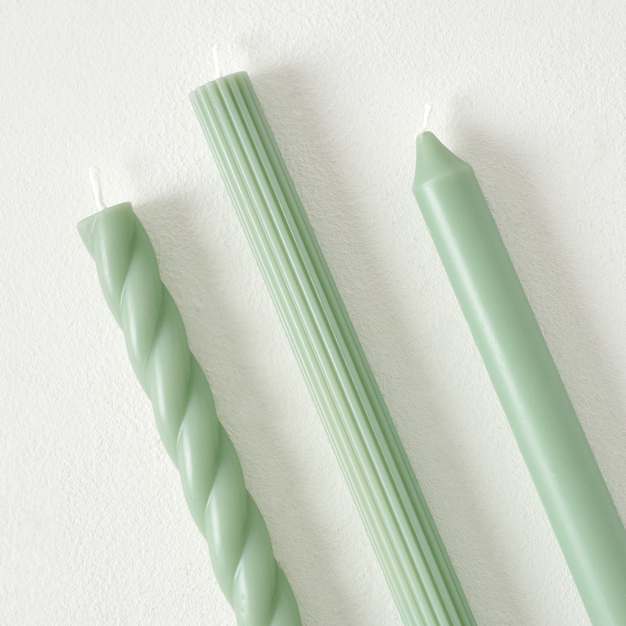 Assorted Sage Green Taper Candle Set up close
