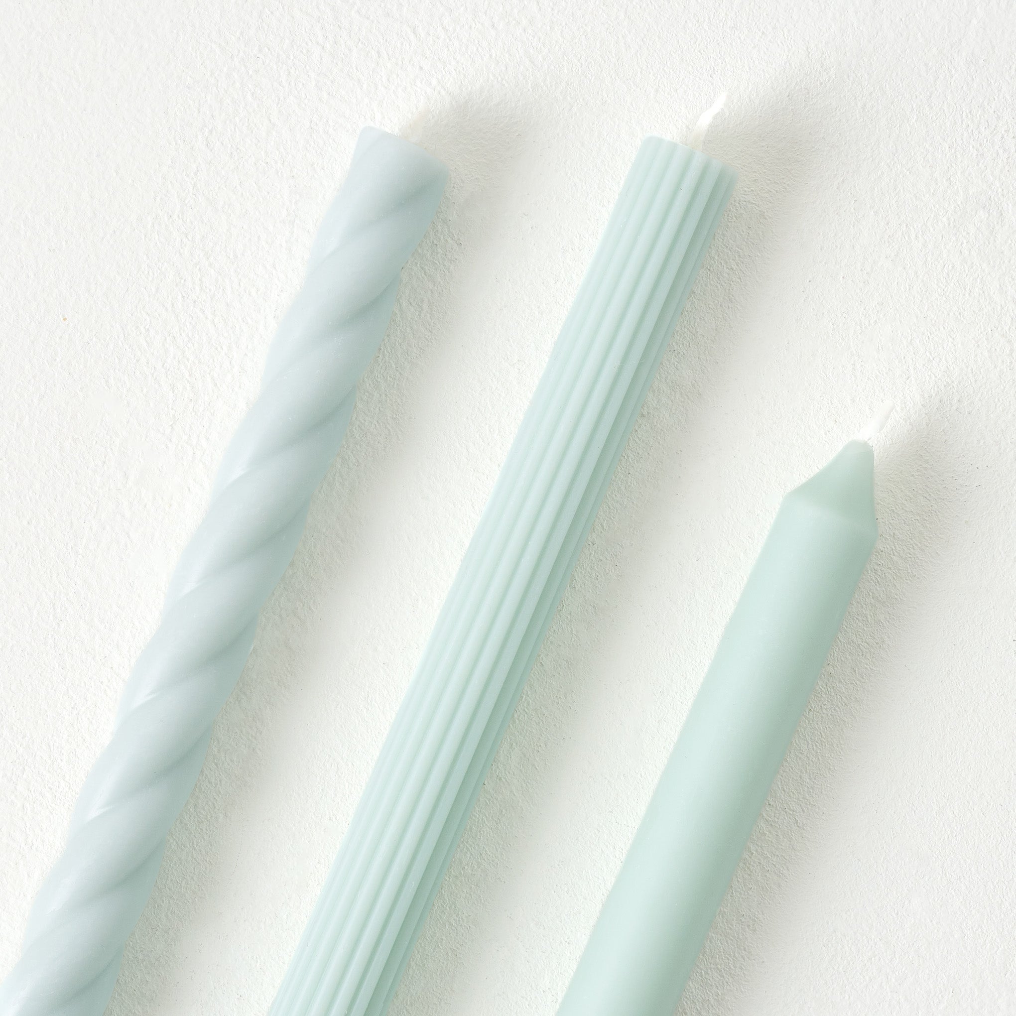 Assorted Light Blue Taper Candle Set up close
