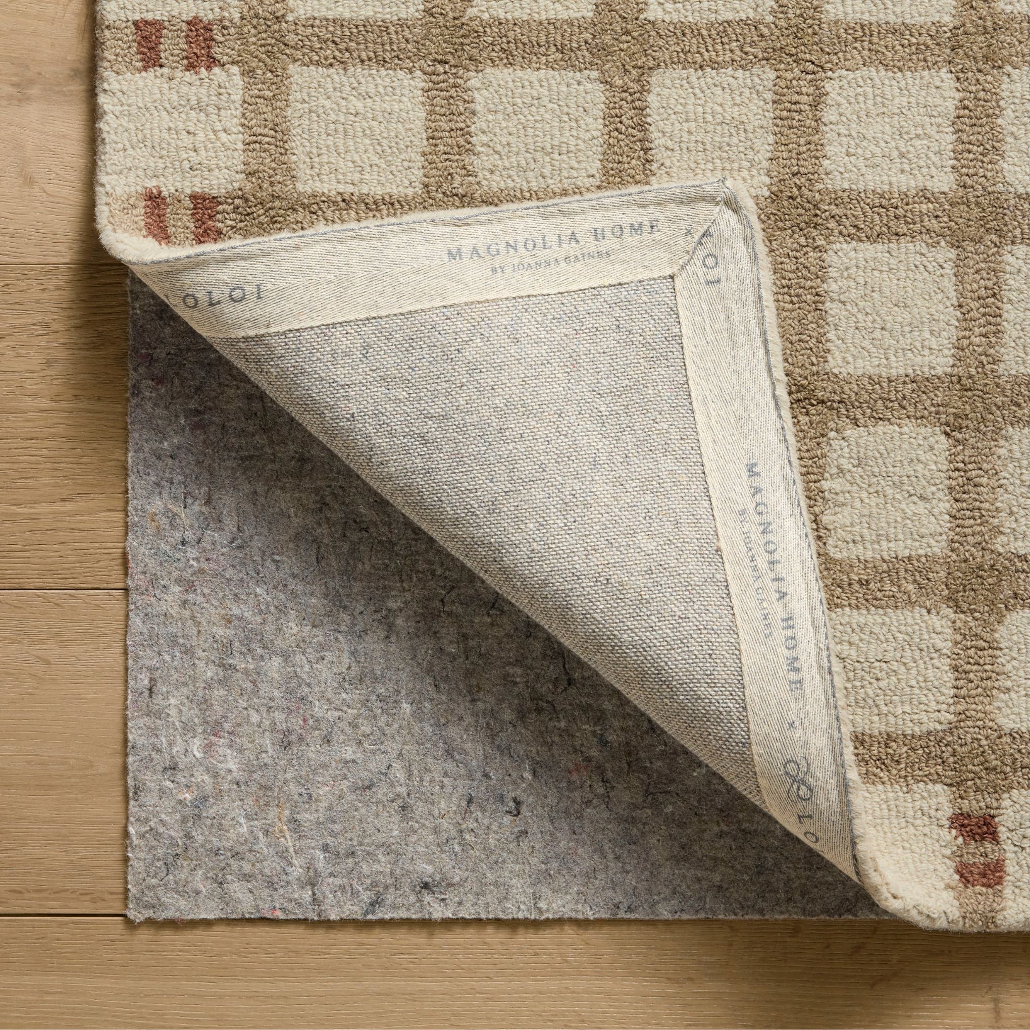 Waylon Natural Rust Rug corner shown flipped