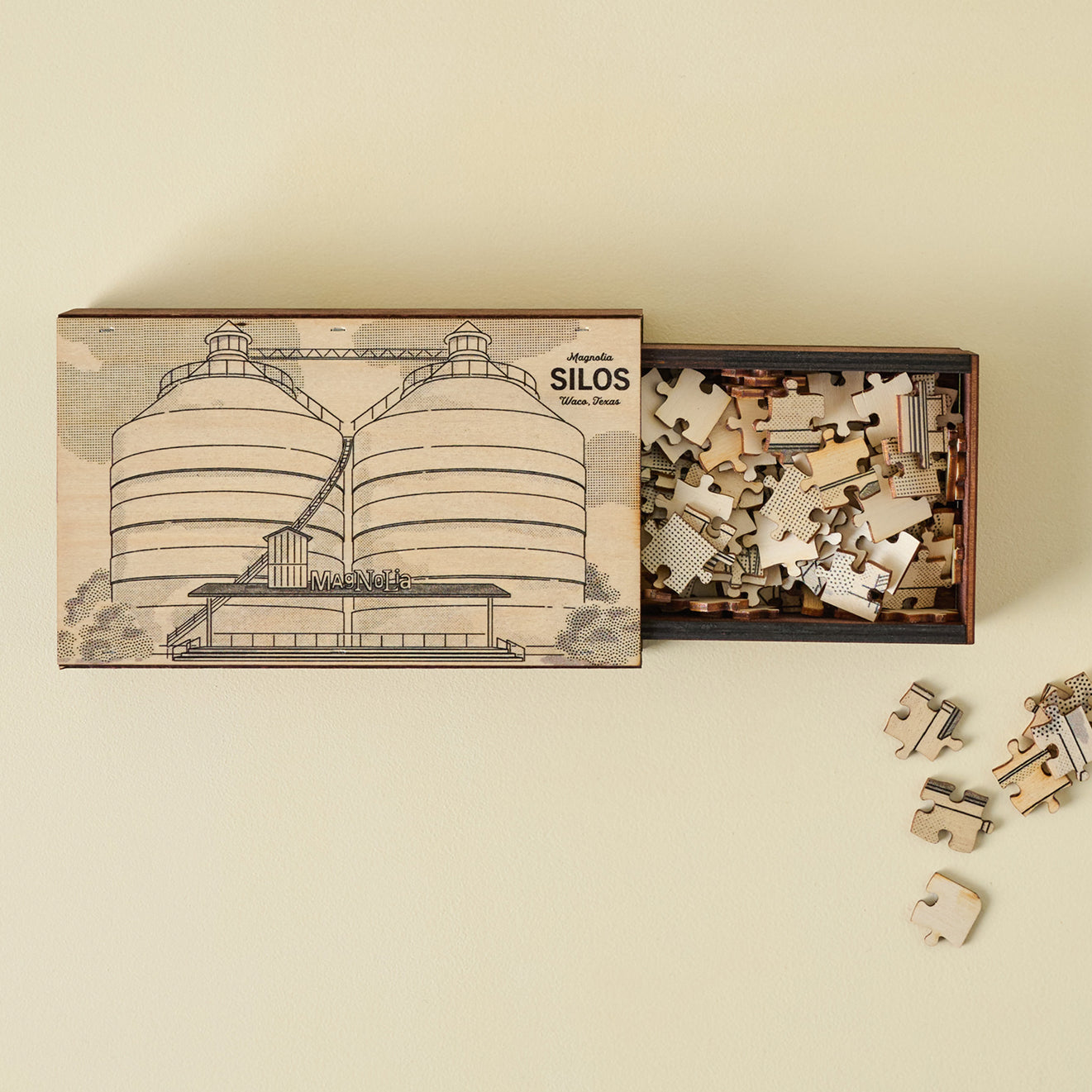 Jigsaw puzzle set with box featuring silo design on a beige background.  shop Magnoliass souvenirs.