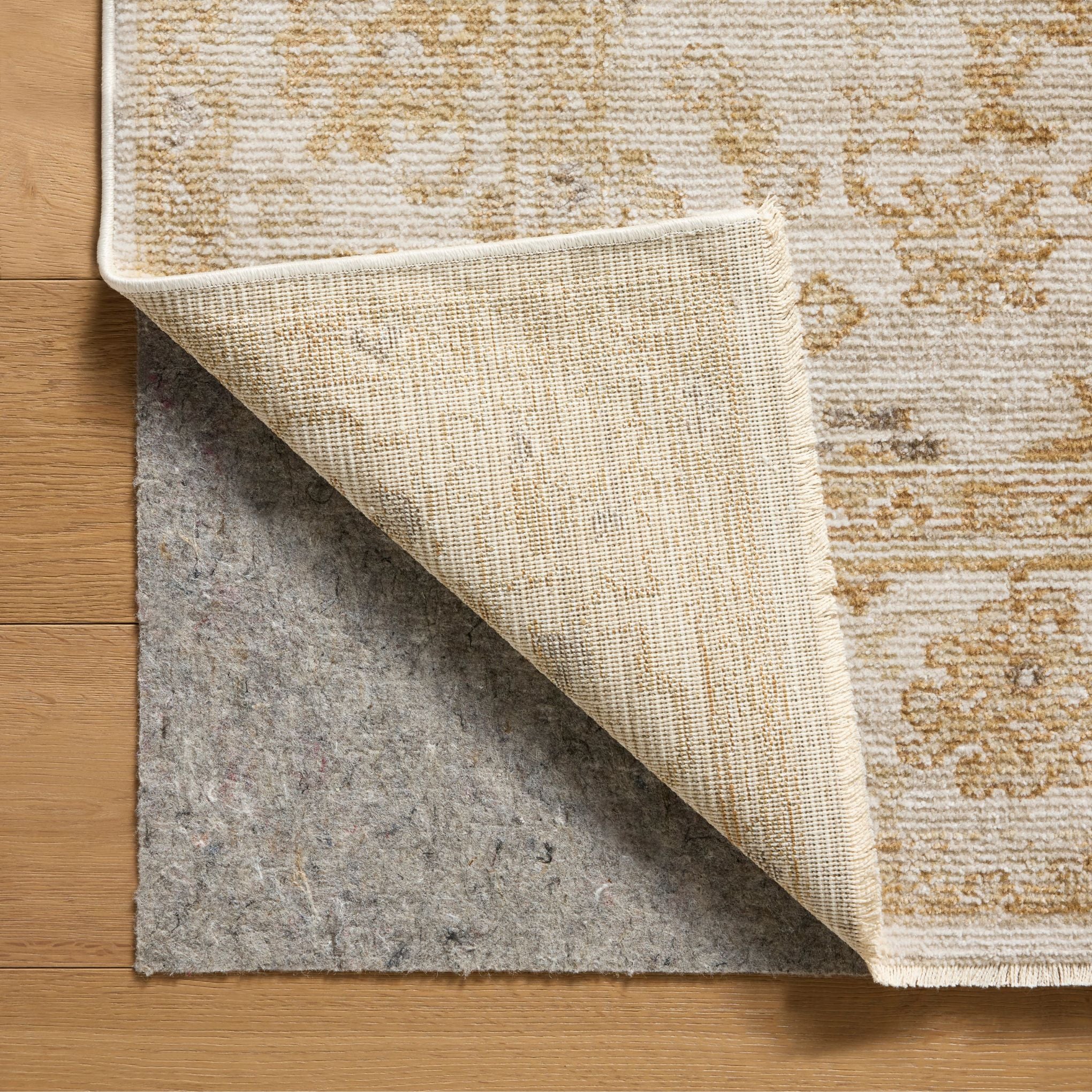 Pace Natural Gold Rug corner shown flipped up