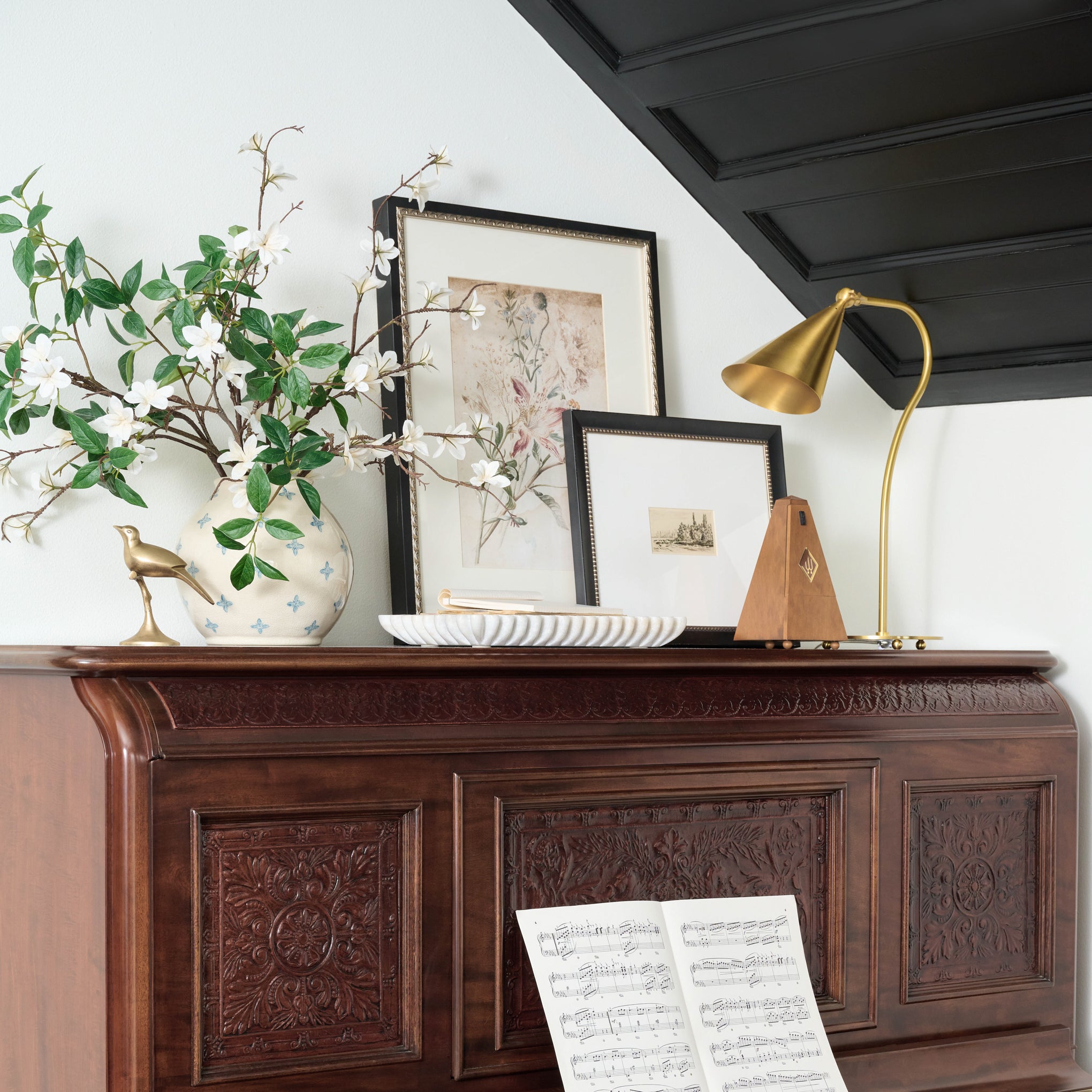 Ruffled Marble Tray on a dresser next to a vase and lamp