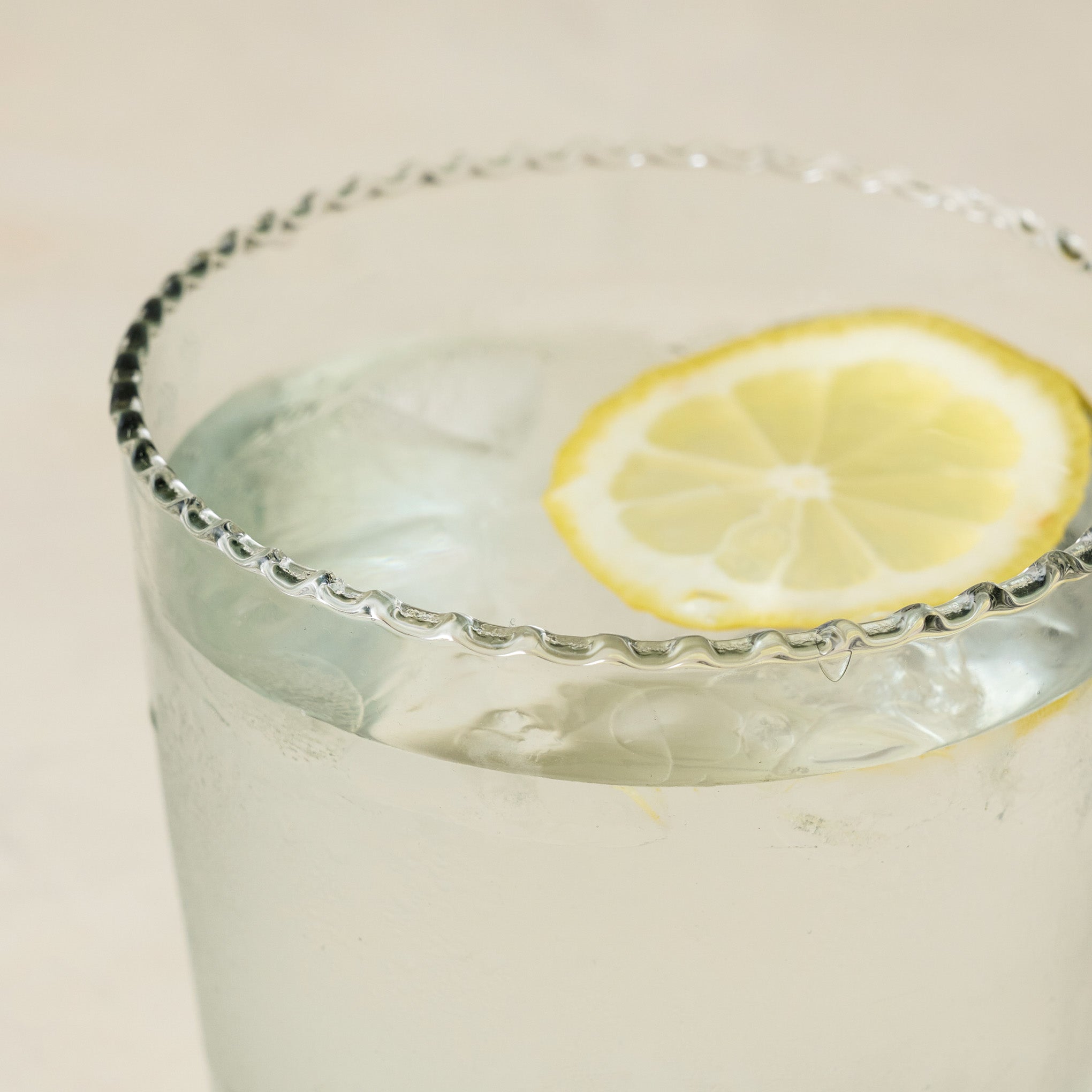 Elizabeth Bottle Cut Glass Tumbler close up with lemon in cup