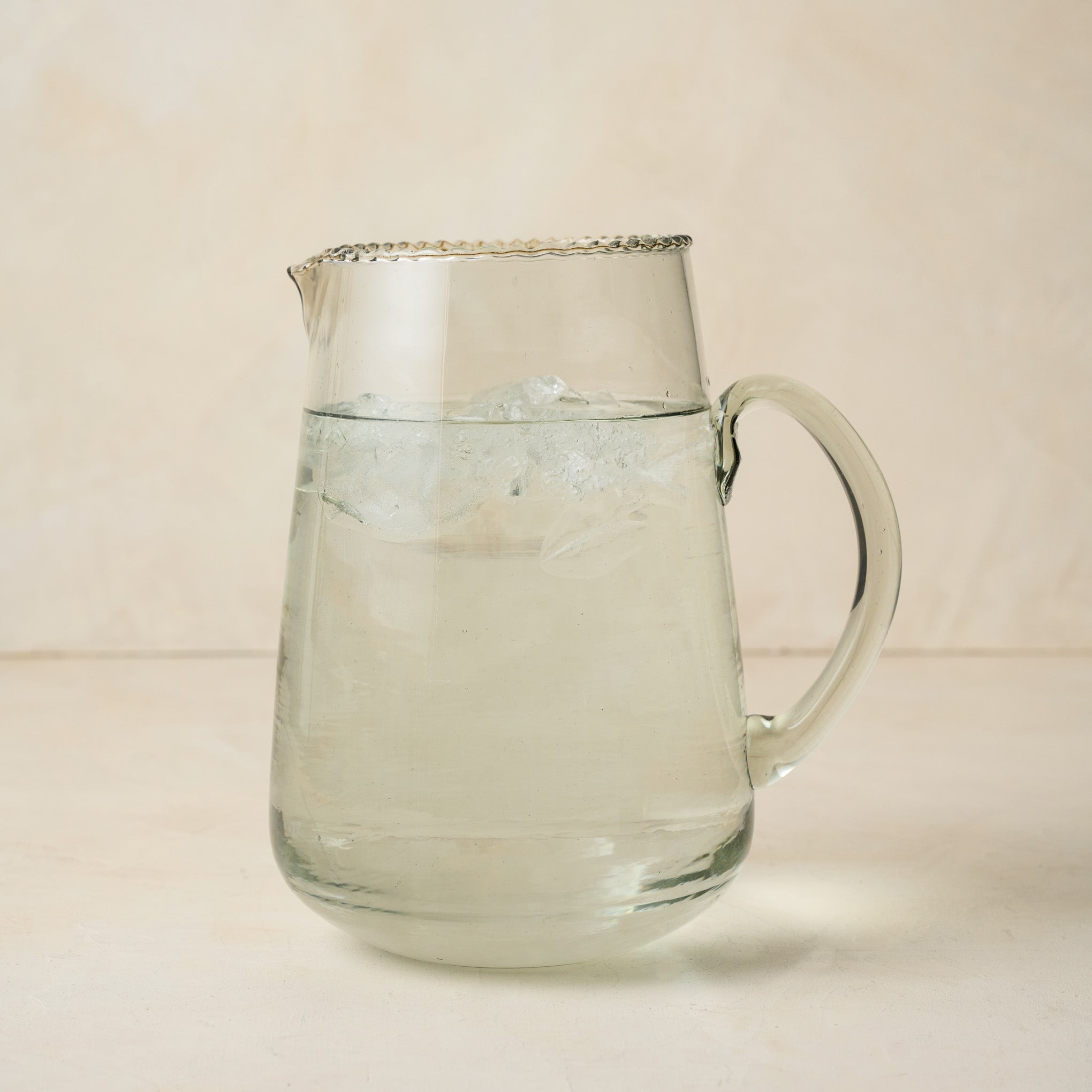 Elizabeth Bottle Cut Pitcher filled with ice water