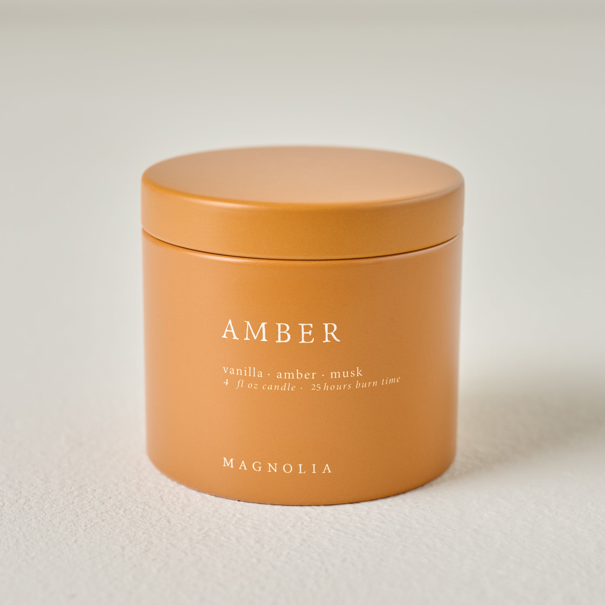 Magnoliass Amber Candle Tin 