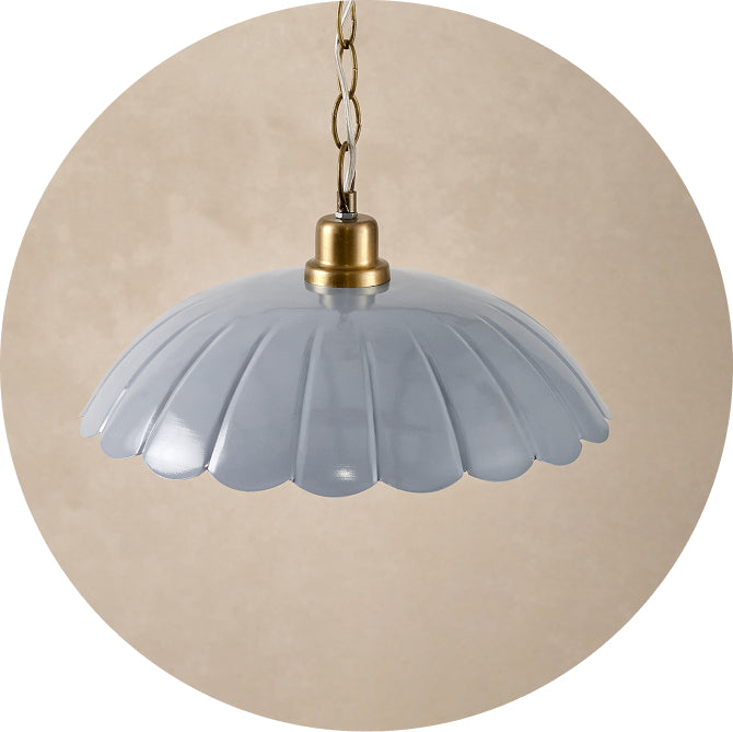 hanging light fixture with blue floral shade and brass hanging chain