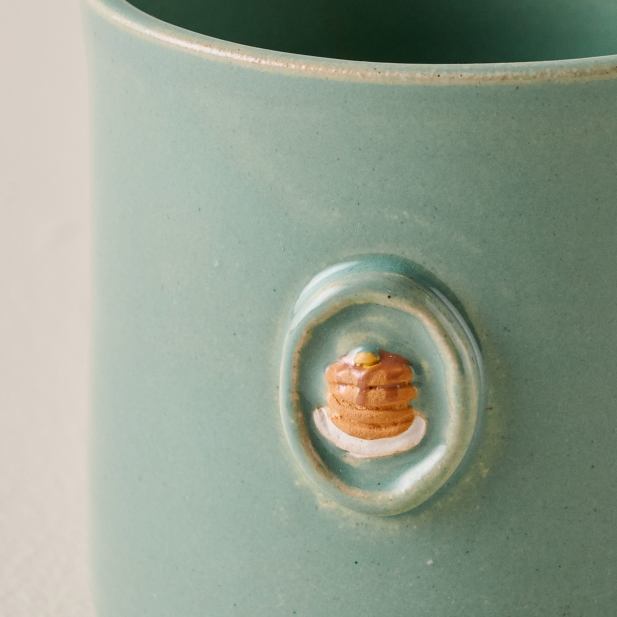 Black Oak Magnoliass Table Pancake Mug up close