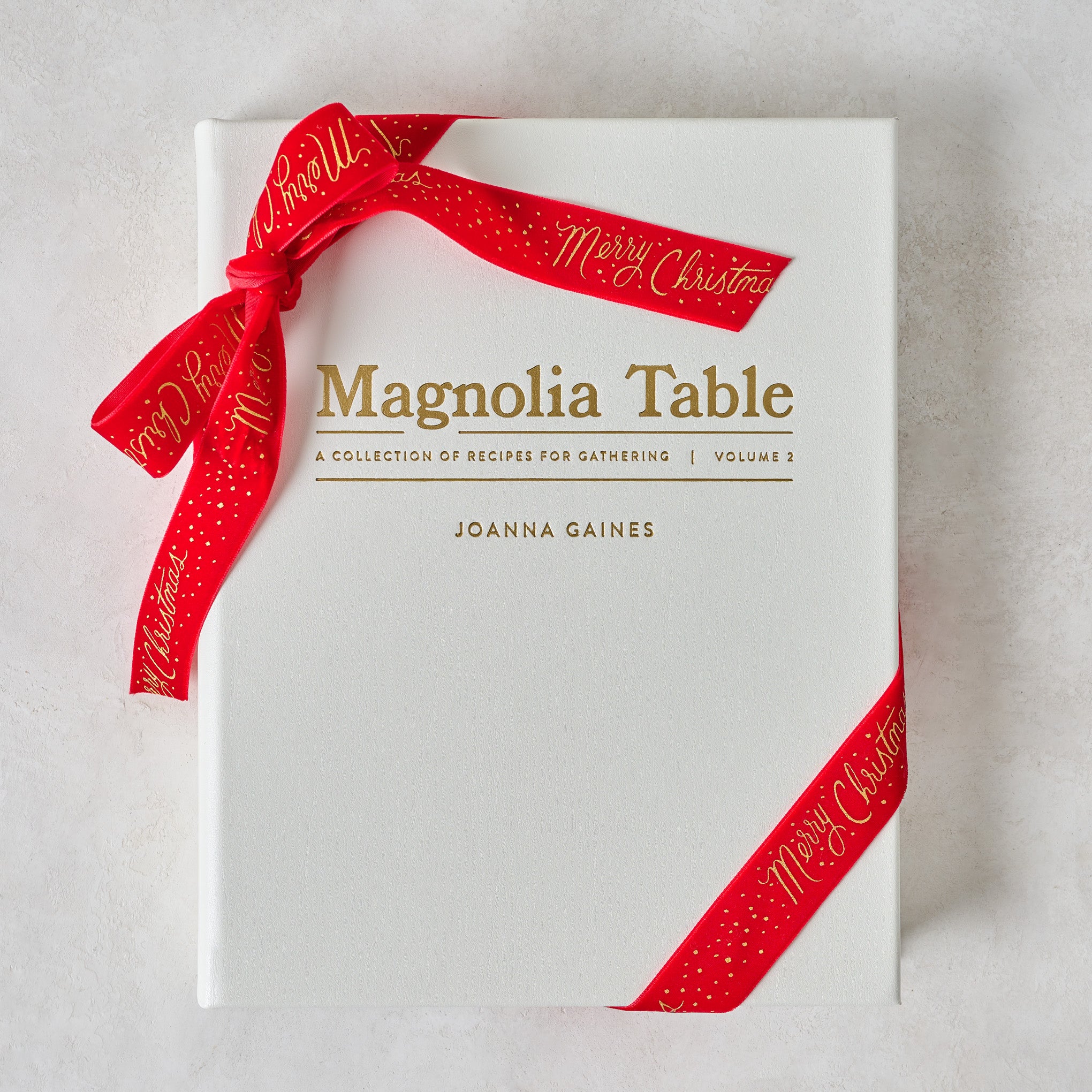 Leather Bound Magnoliass Table, Volume 2 shown with ribbon