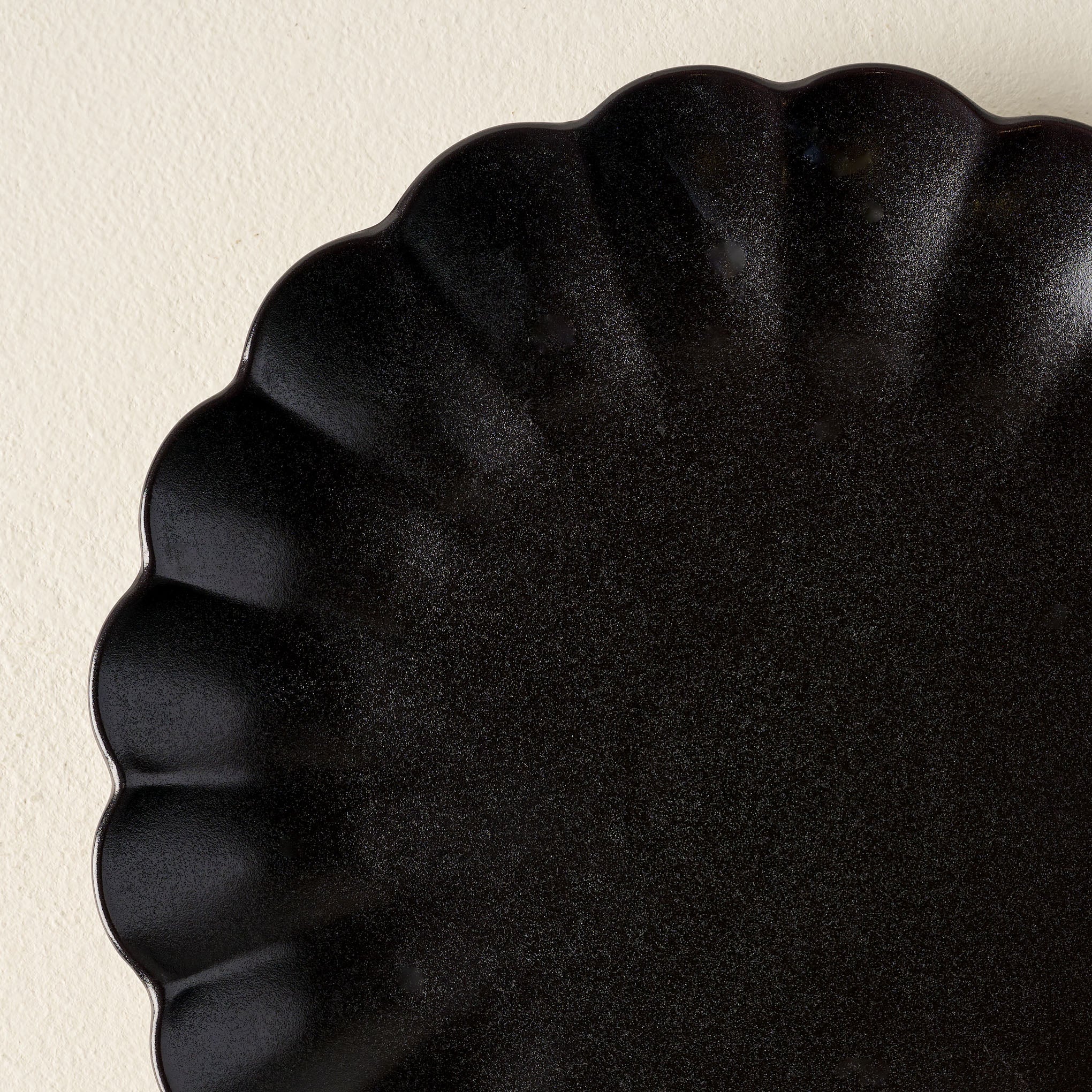 Black Scalloped Plate close up