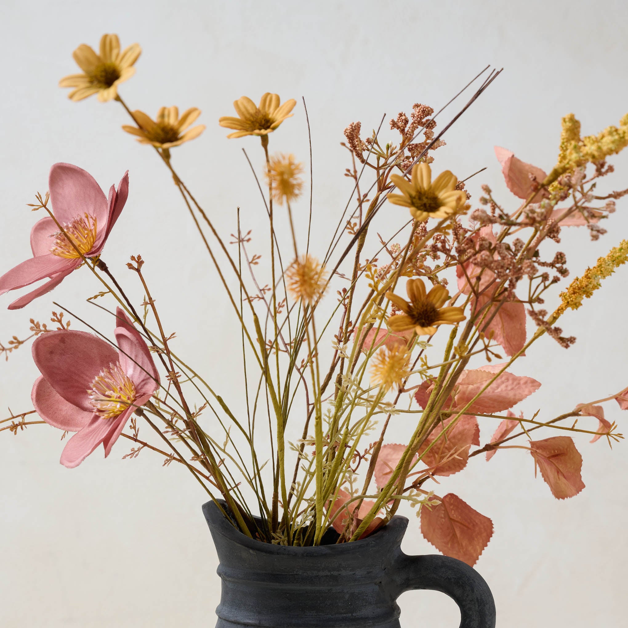 Harvest Bouquet bloom close up in black jug vase