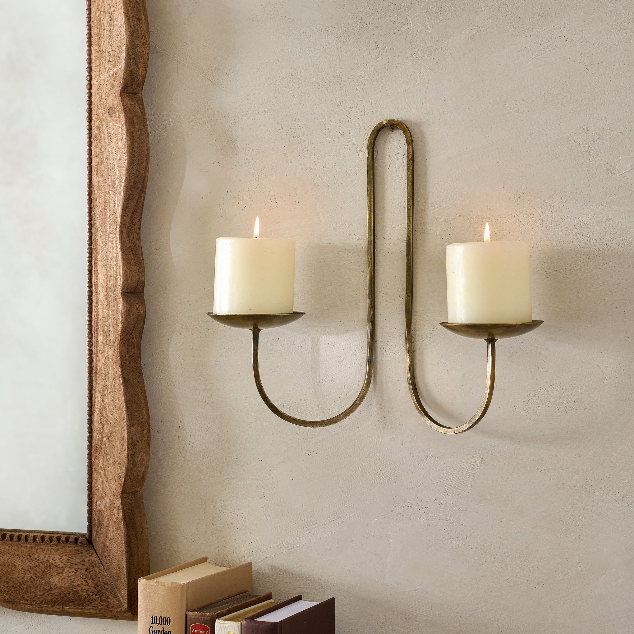 Daniel Antique Brass Candle Sconce shown with candles