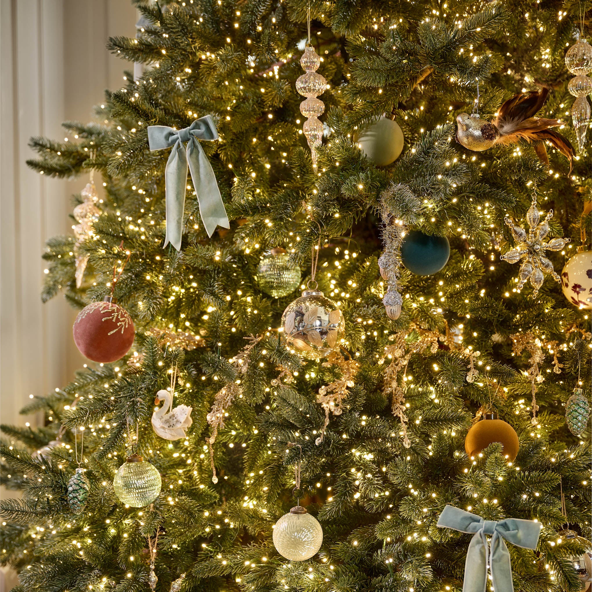 Winter Splendor Finial Ornament on a tree