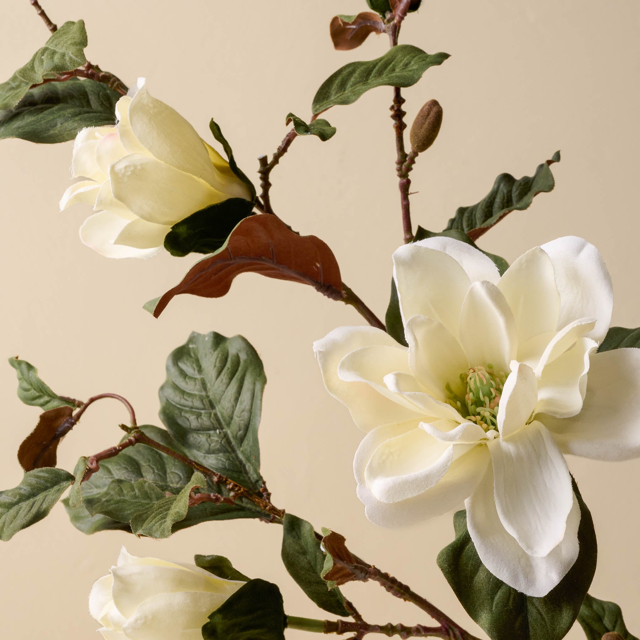 close up detail of faux Magnoliass floral stem