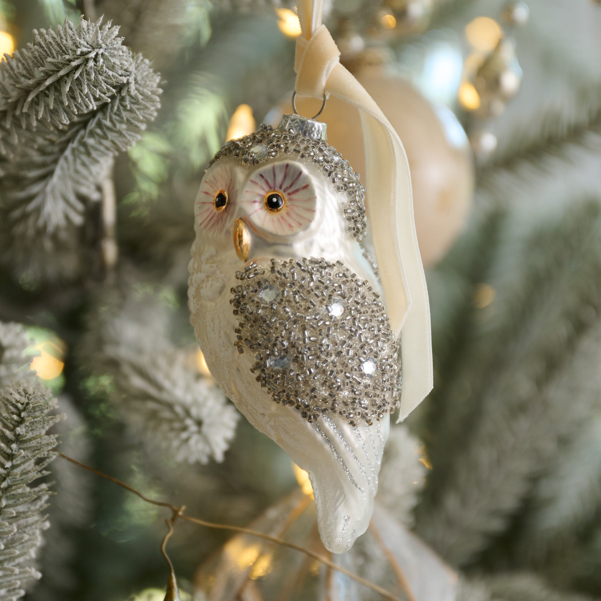 Start of Something Owl Ornament shown hung on christmas tree