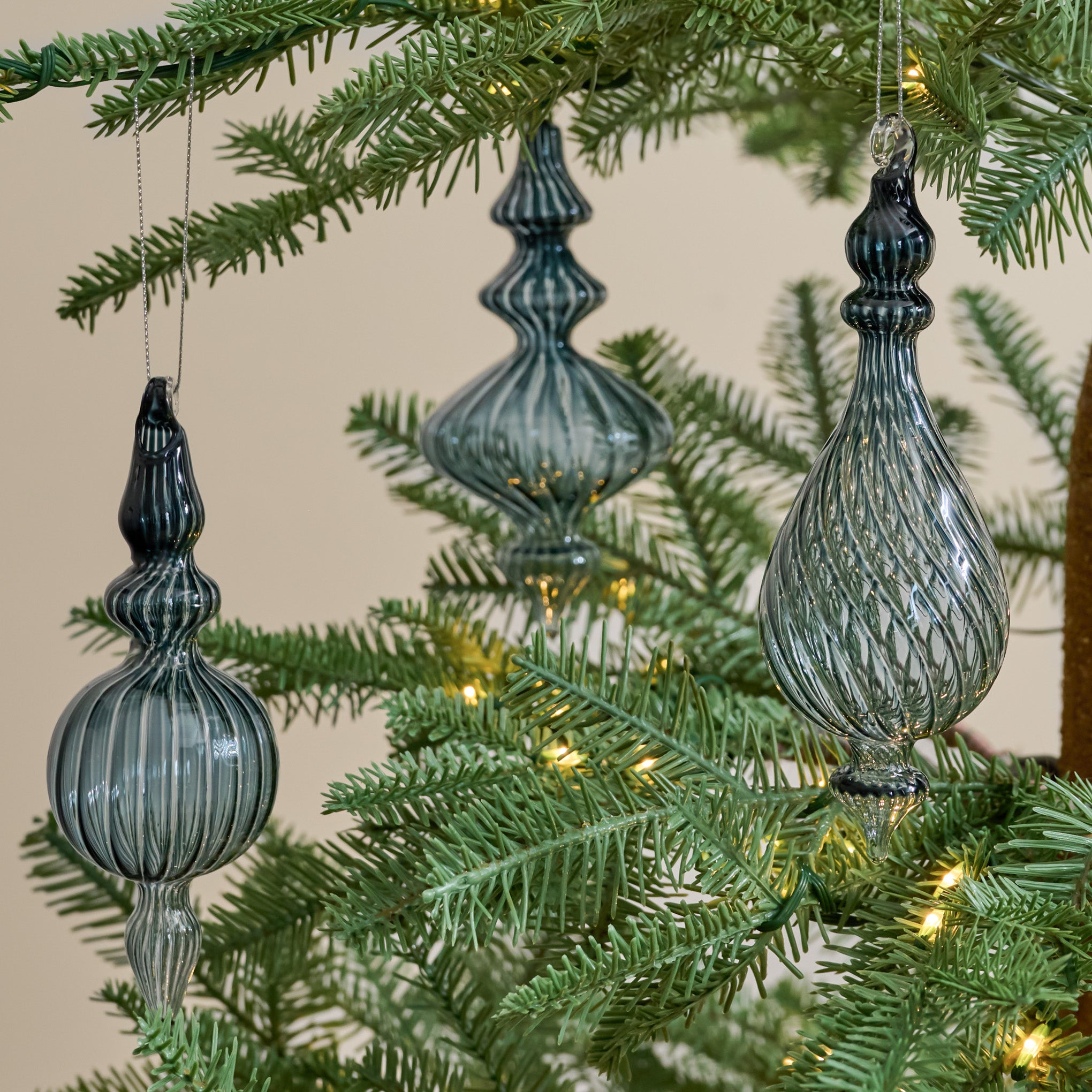 Blue Enchanted Finial Glass Ornaments, Set of 3 shown hung on tree