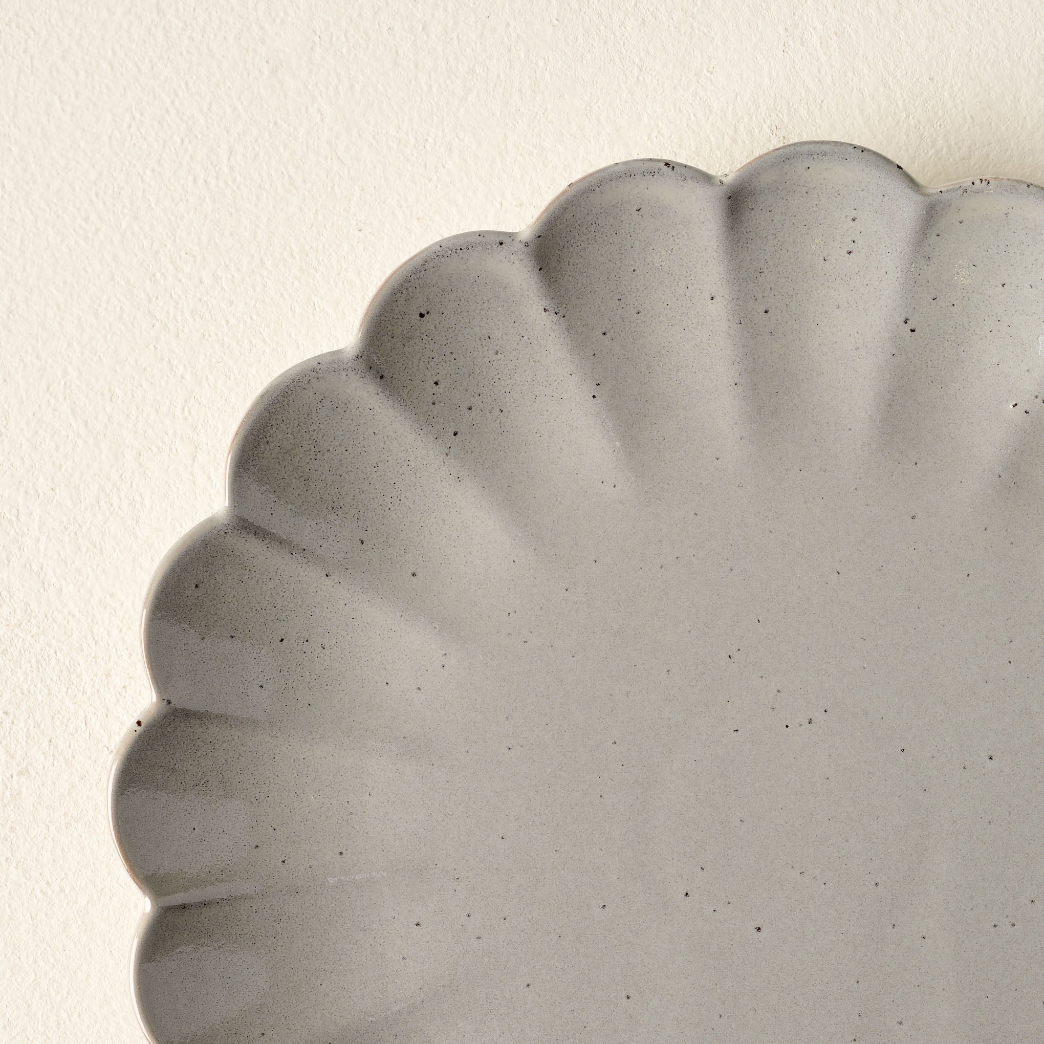 Grey Scalloped Plate close up