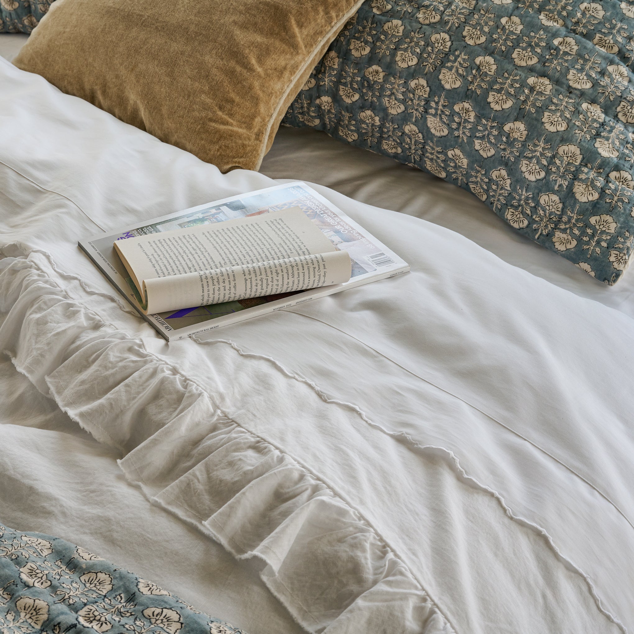 Optic White Scalloped Edge Sheet Set shown on bed