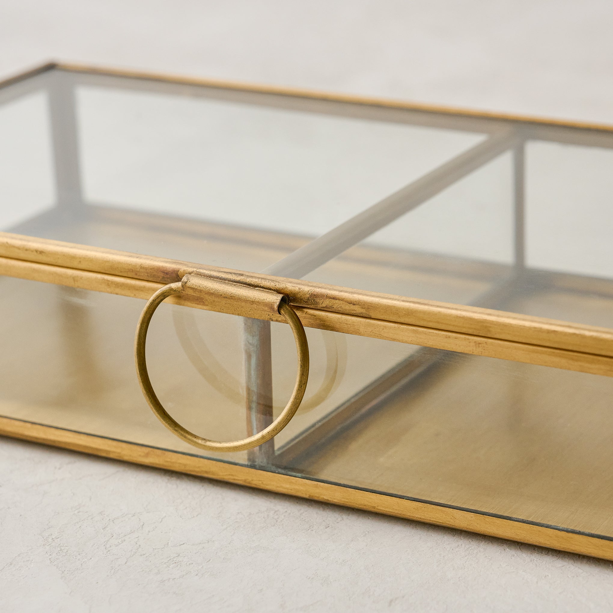 detail view of Magnoliass antique brass keepsake box handle