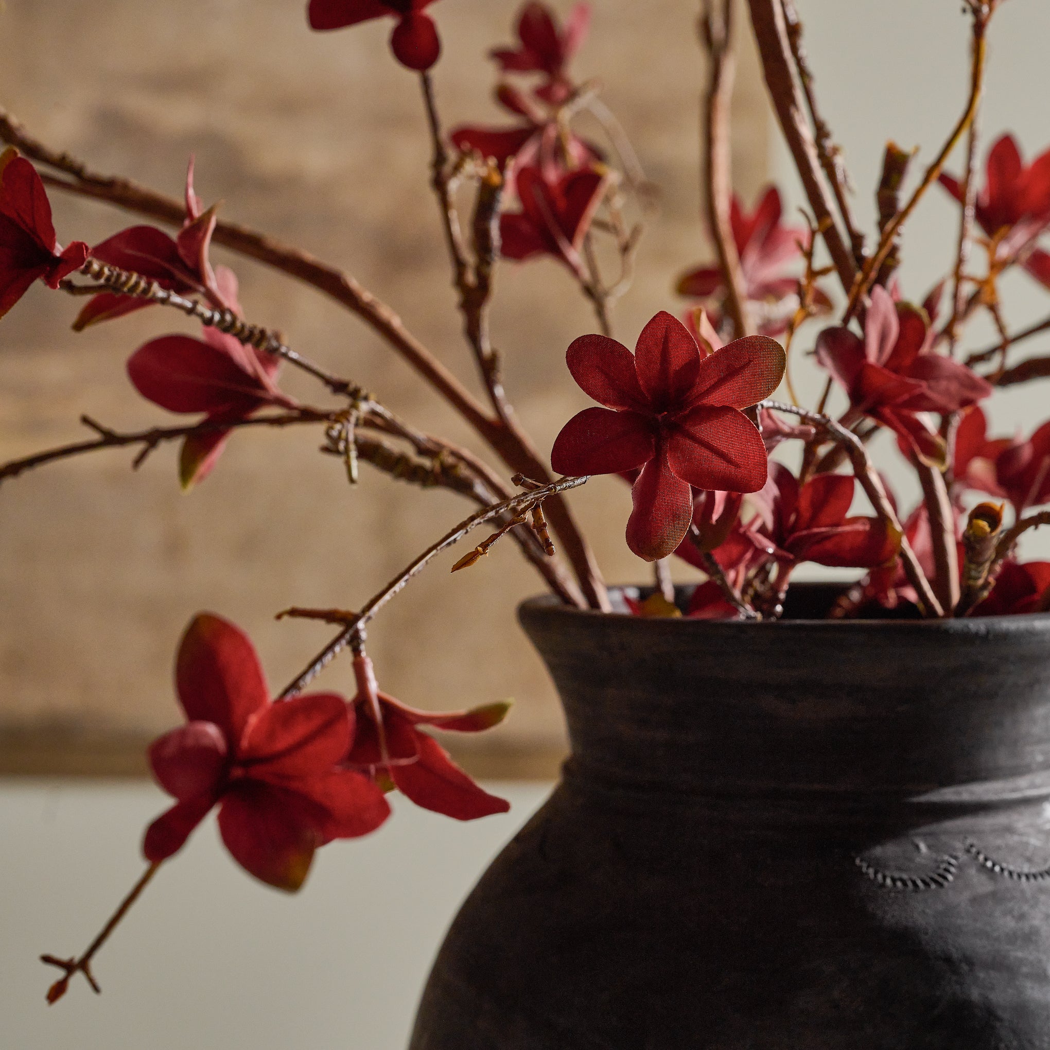 Large Magnoliass Bloom Spray shown up close in dark vase