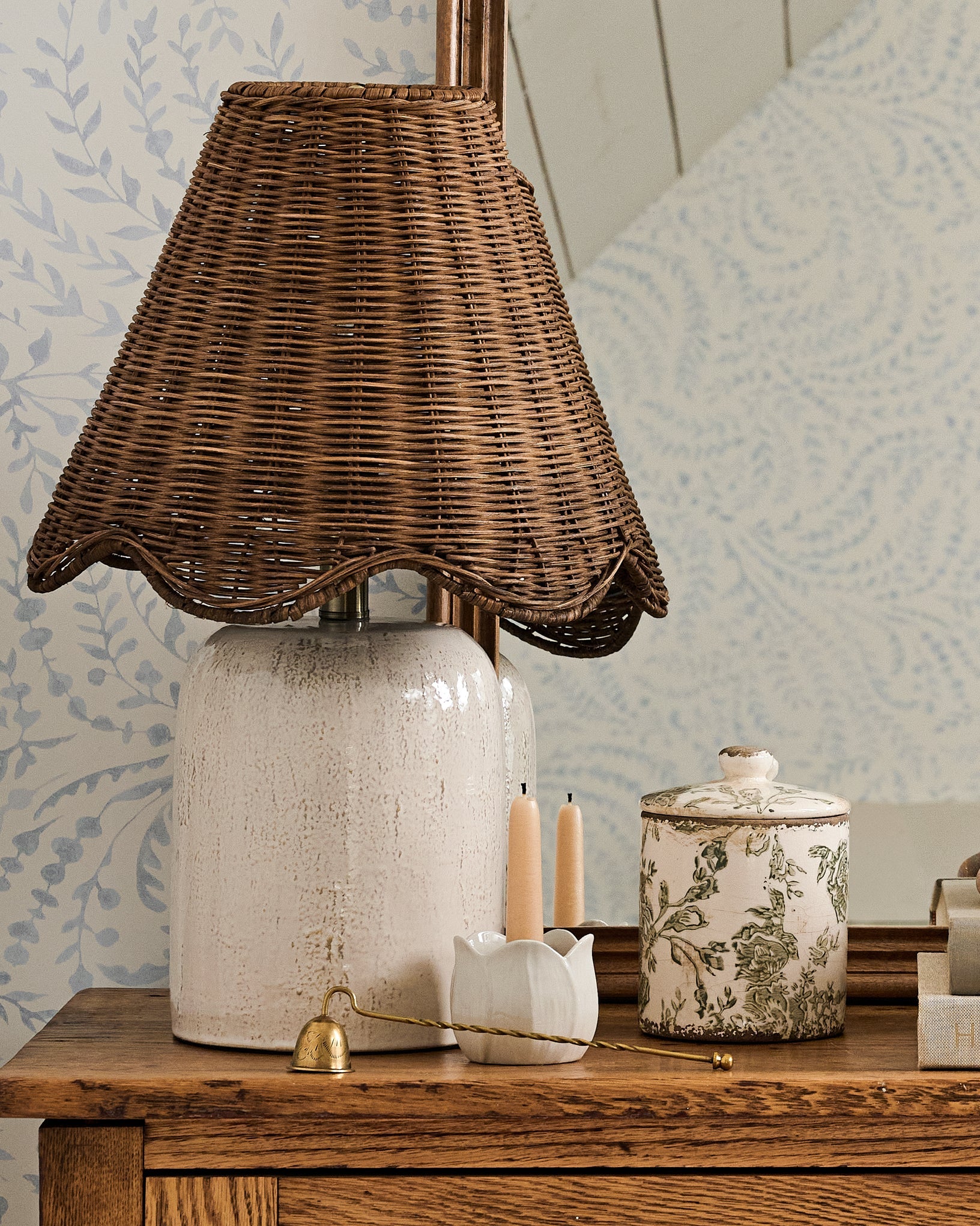 Small Green and White Distressed Canister on a dresser next to a table lamp