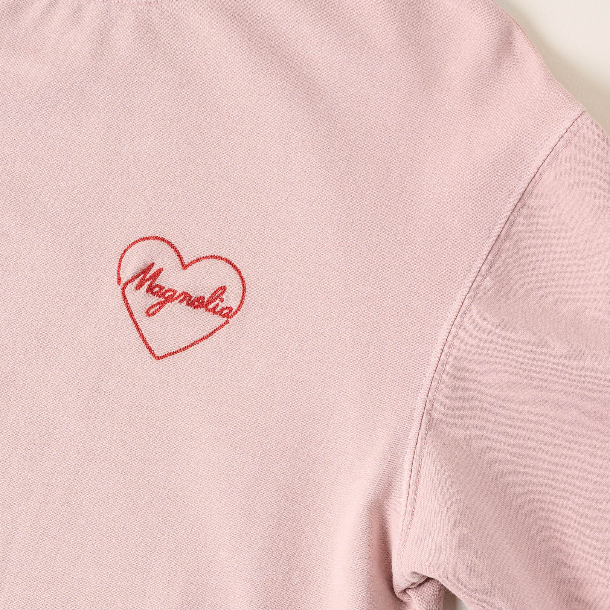 Embroidered Heart Blush Sweatshirt close up of heart design