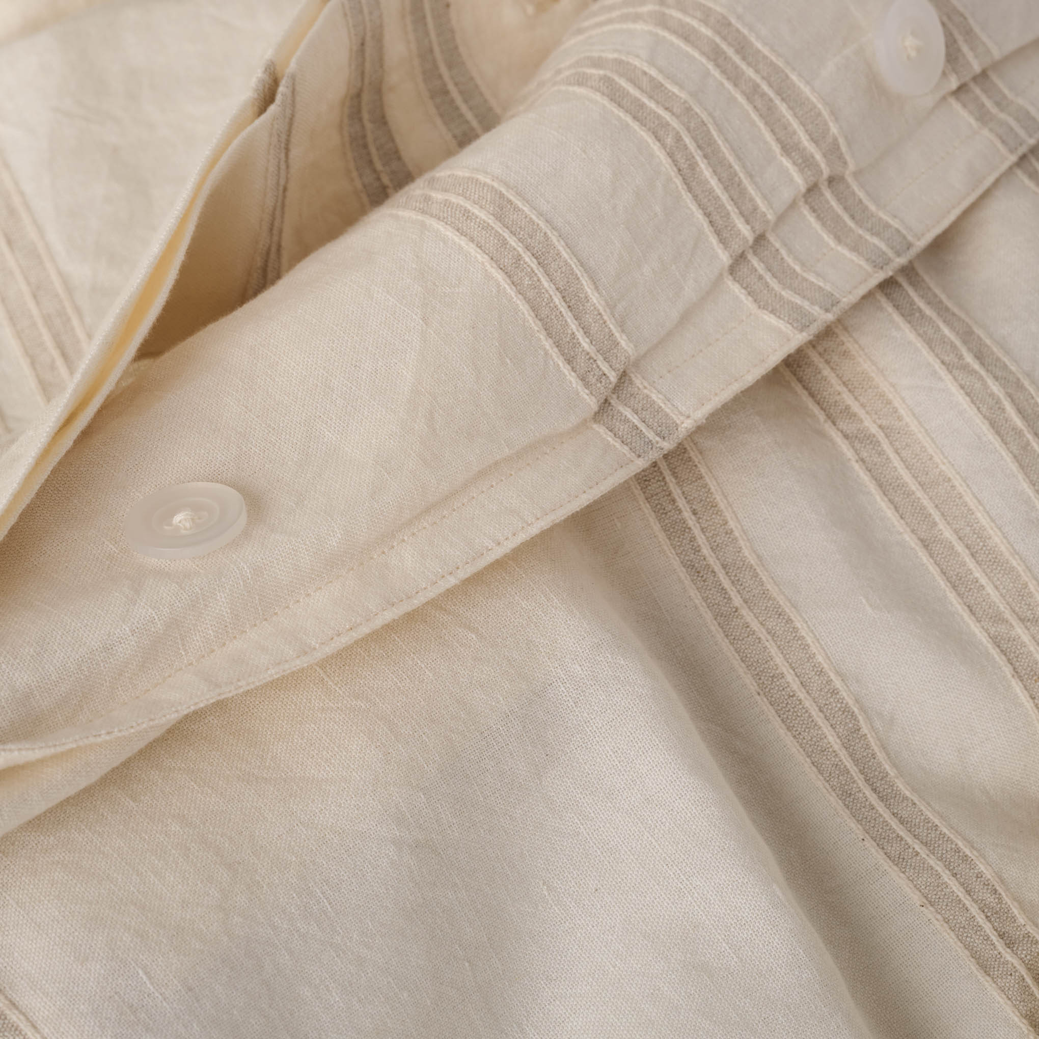 Button detail on Embroidered Oatmeal Stripe Linen Cotton Duvet