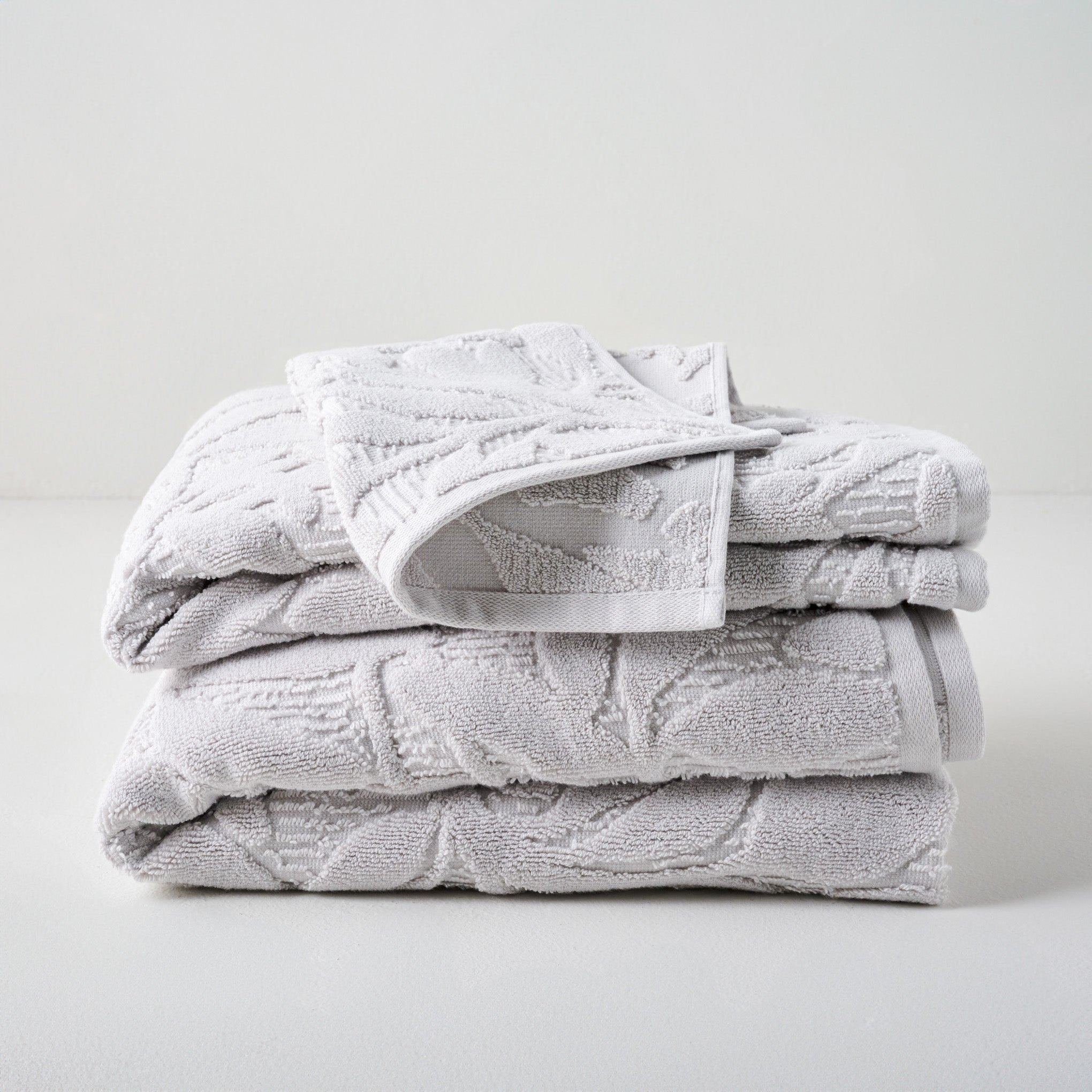 Platinum Esme Floral Towels shown stacked