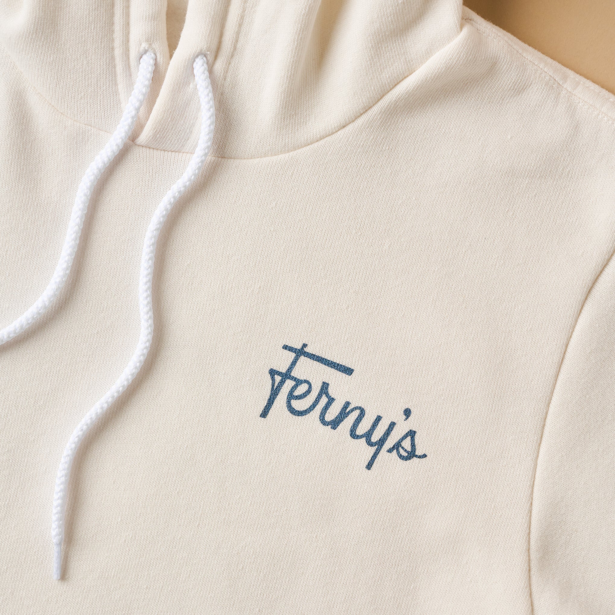 Ferny's Retro Ticket Hoodie close up of fernys logo 