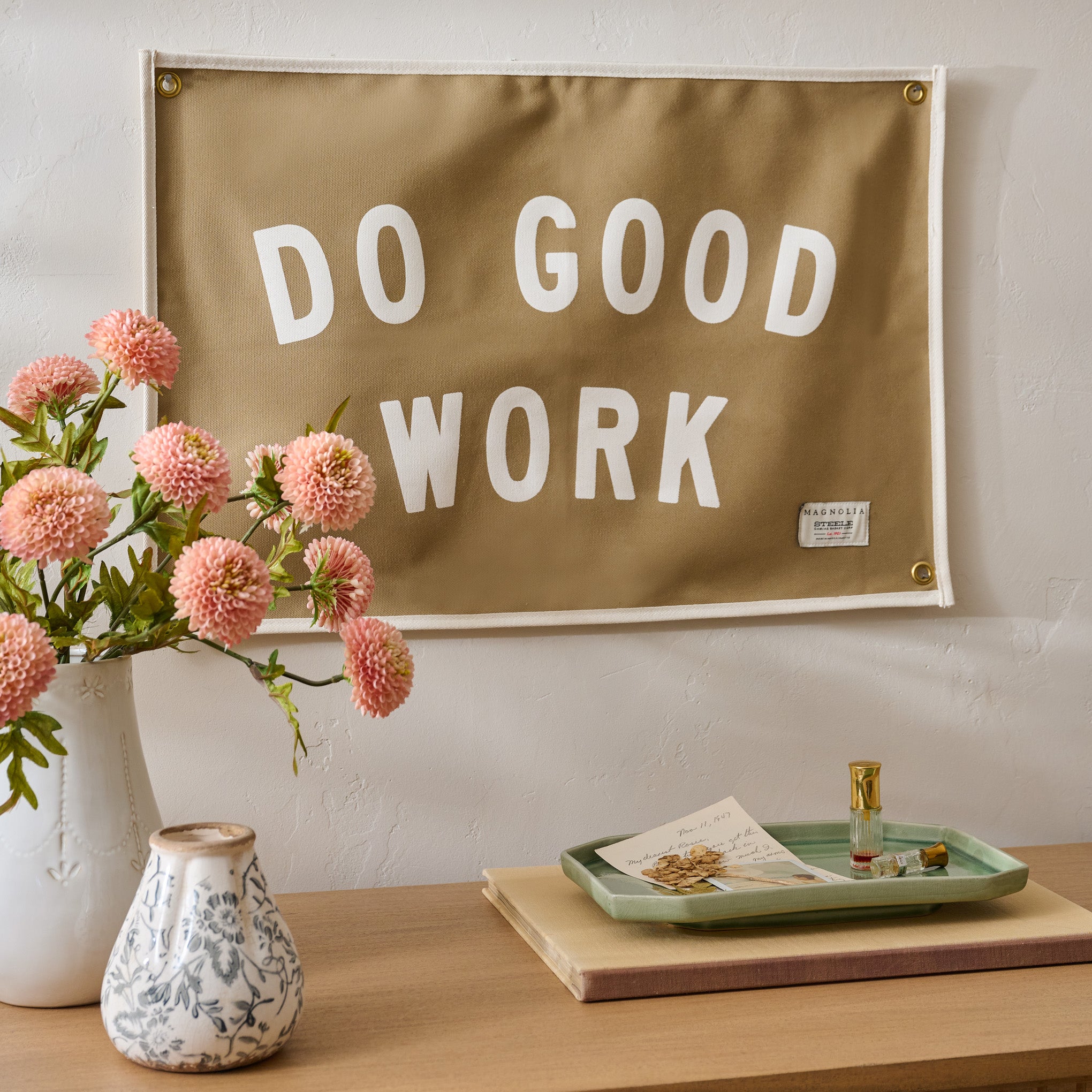 "Do Good Work" Canvas Flag shown hung above dresser